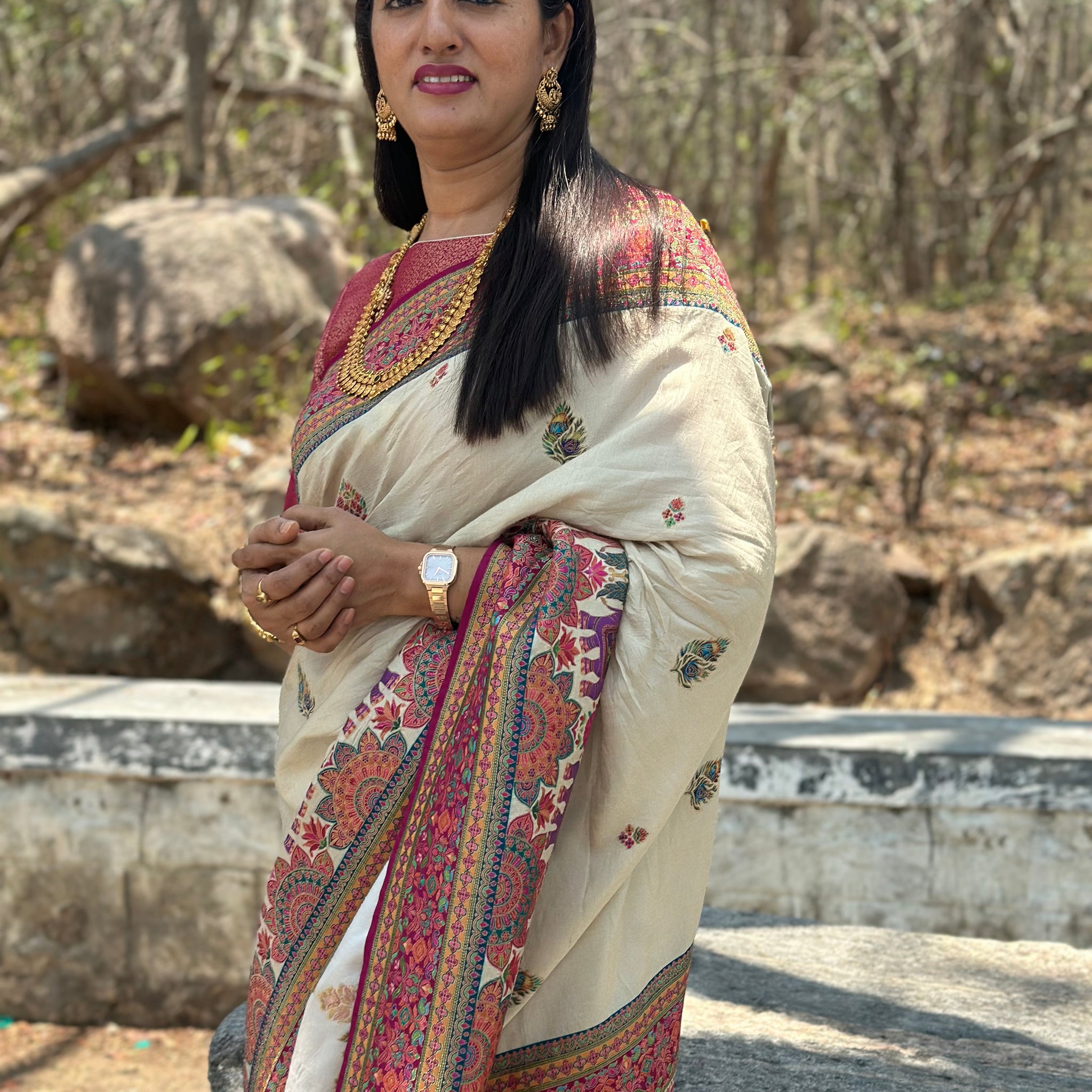 Half white pure moonga crepe with Kashmiri weaving. Pink Brocade blouse.