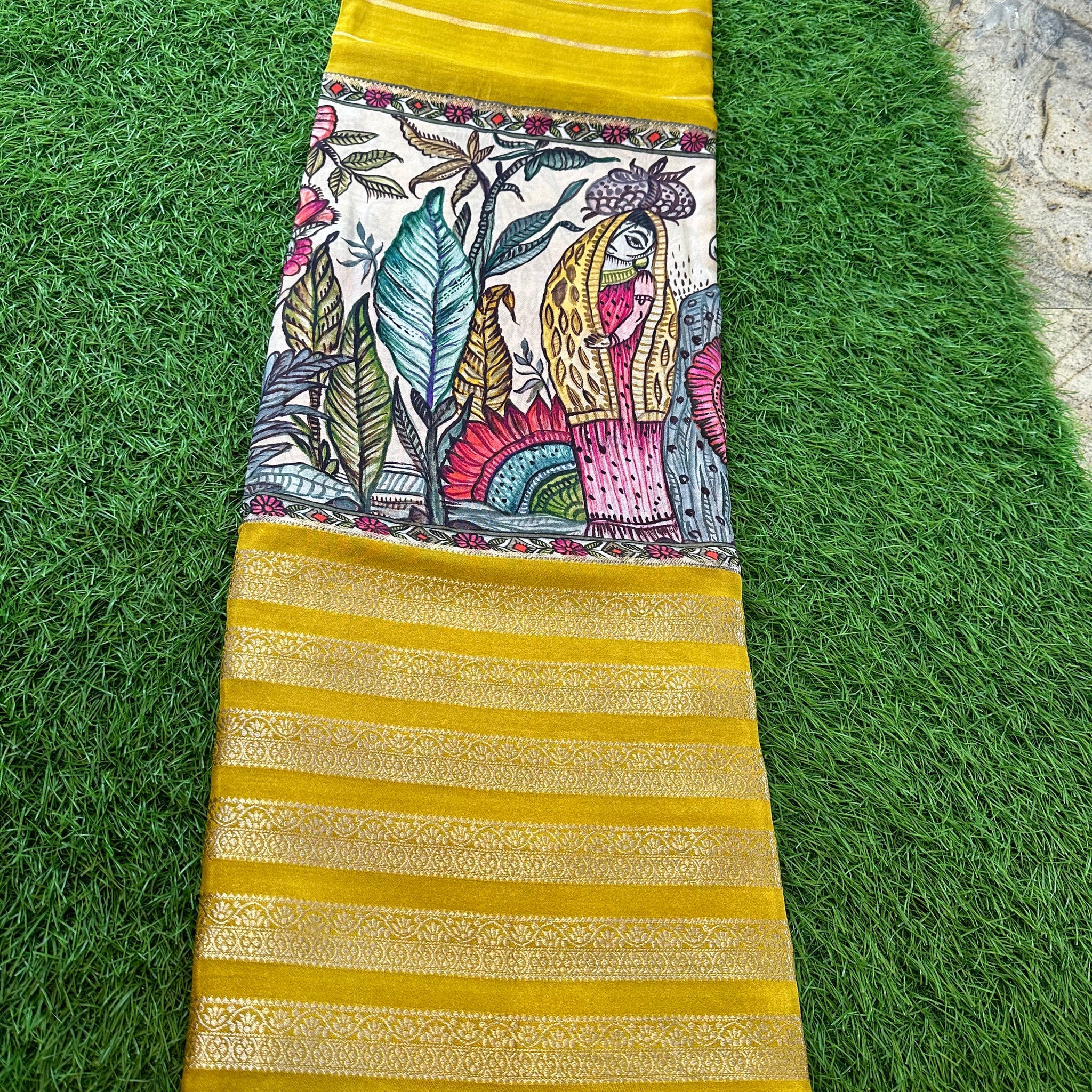 Yellow and red semi crepe kalamkari saree.