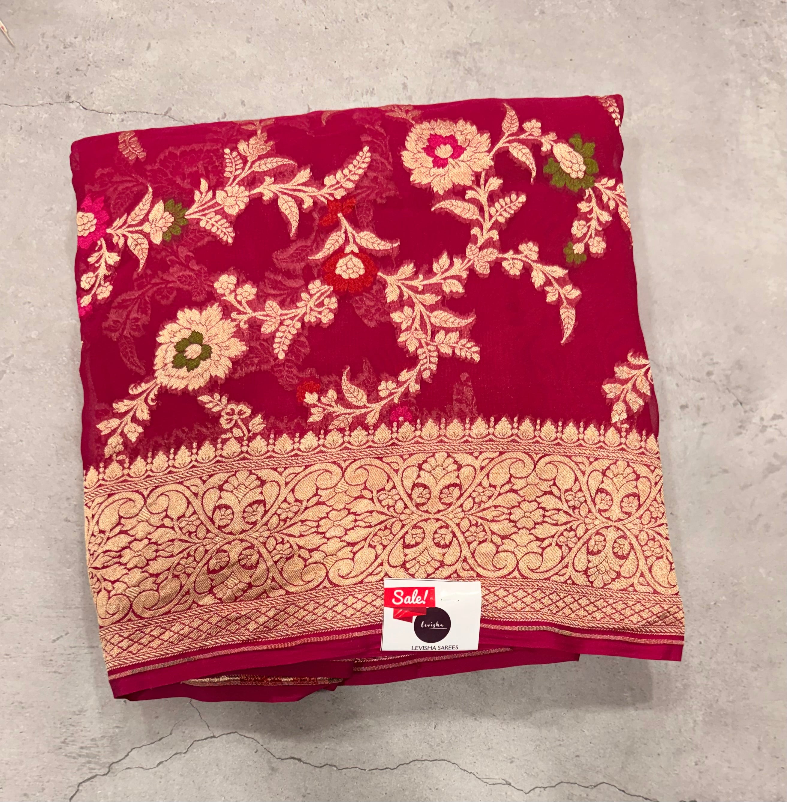 Rani pink  jaal pattern pure georgette with water zari saree