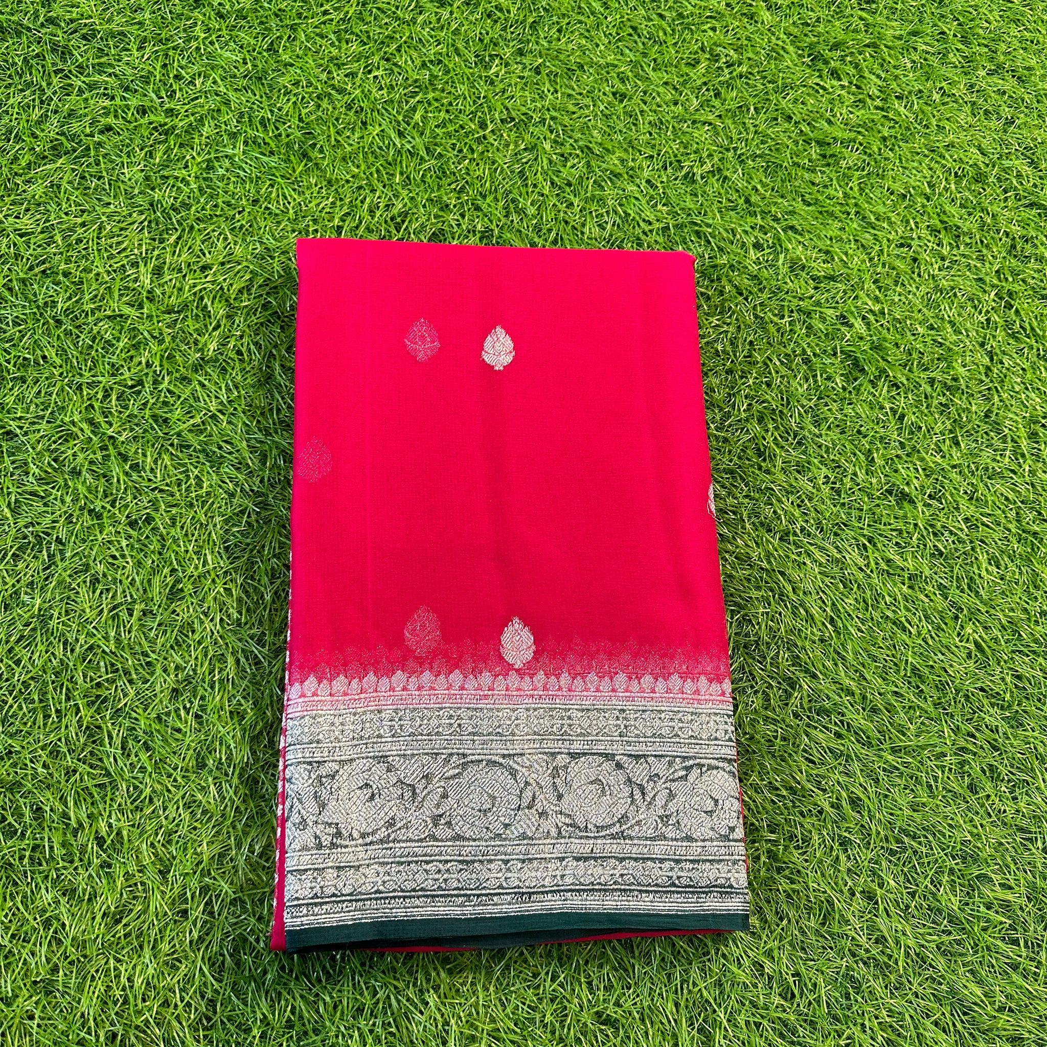 Rani pink with green, pure khaddi Georgette Banarasi sarees.