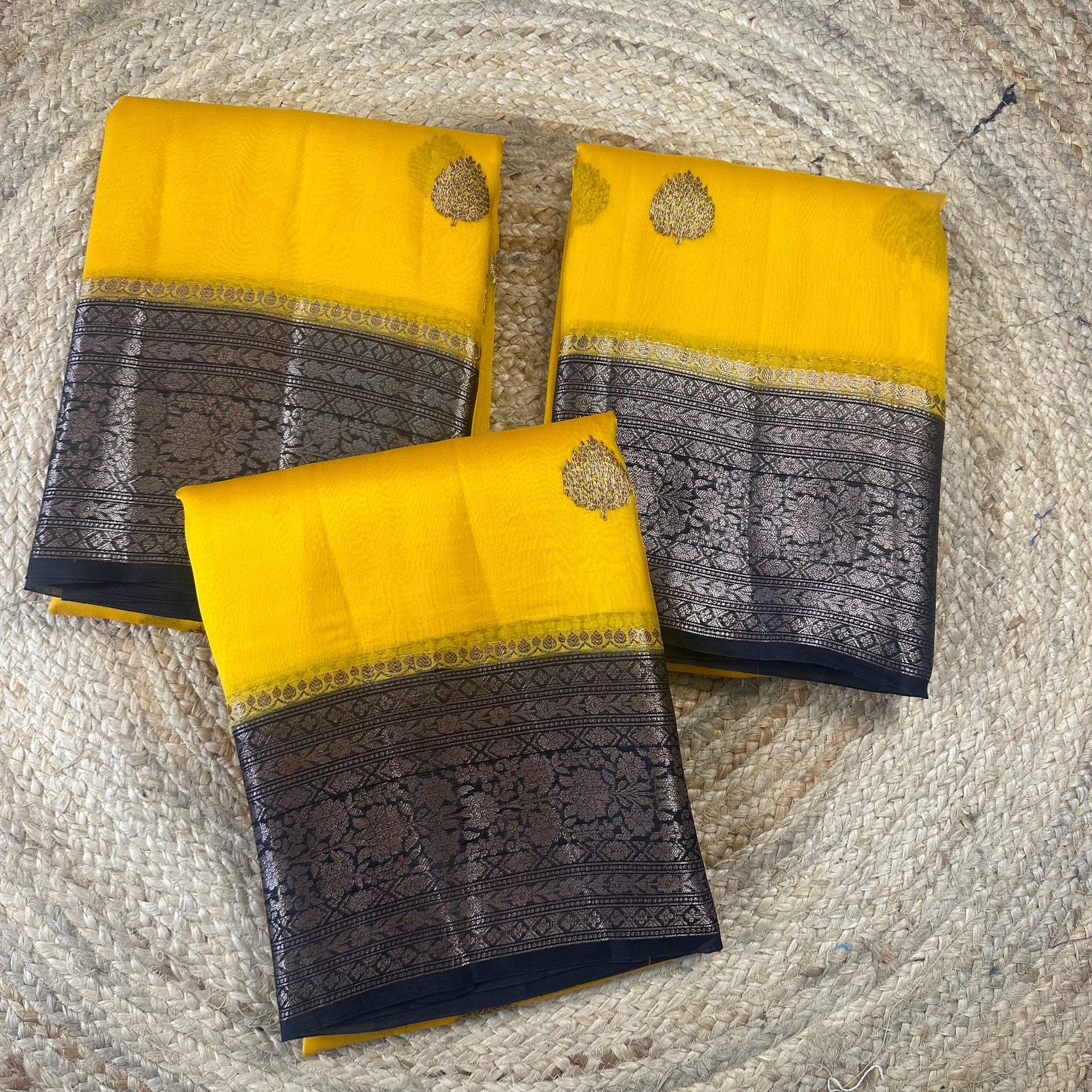 Yellow and black pure kora organza Banaras handloom silk sarees.