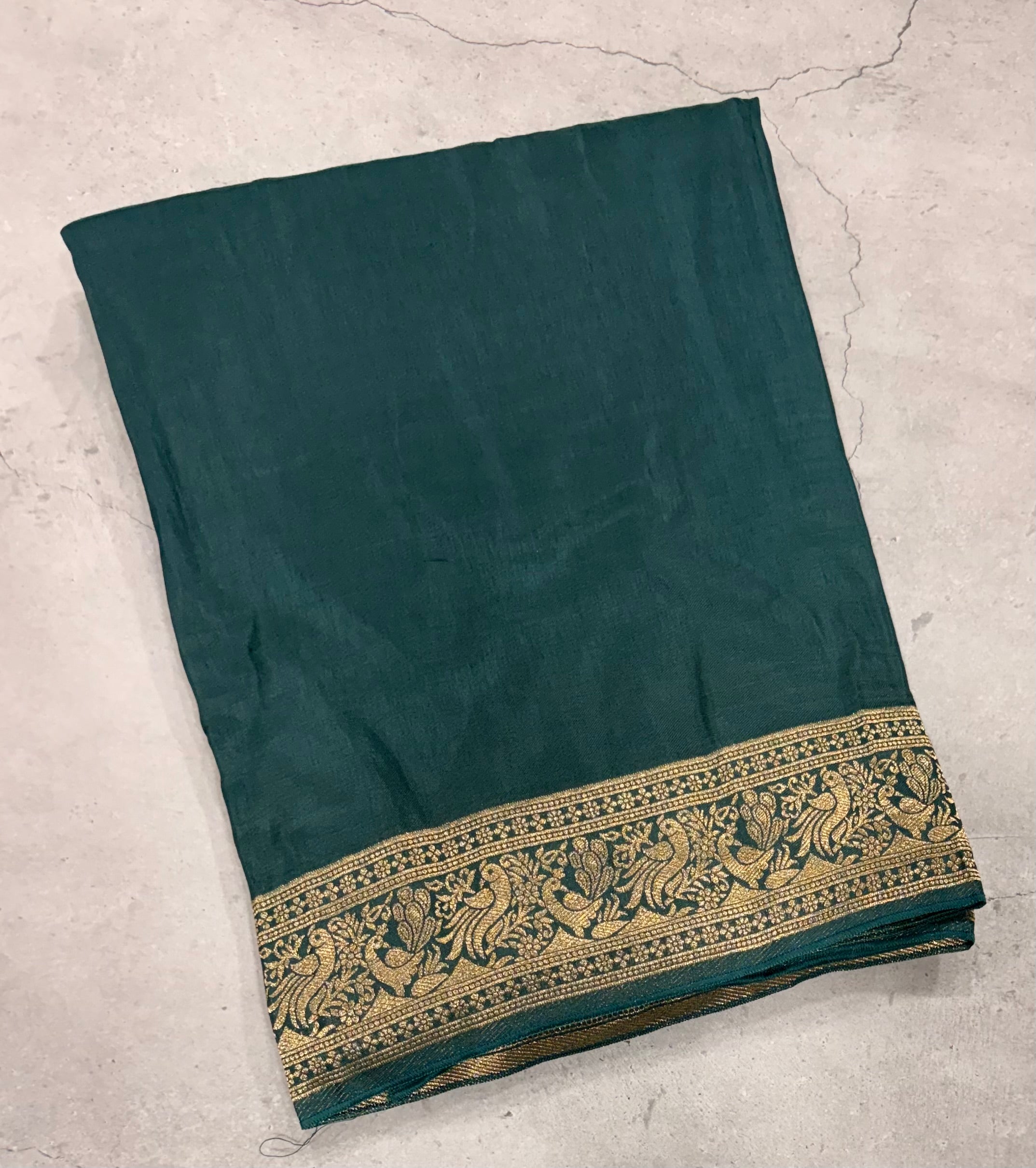 Dark Rama green Kanchi border plain modal silk saree