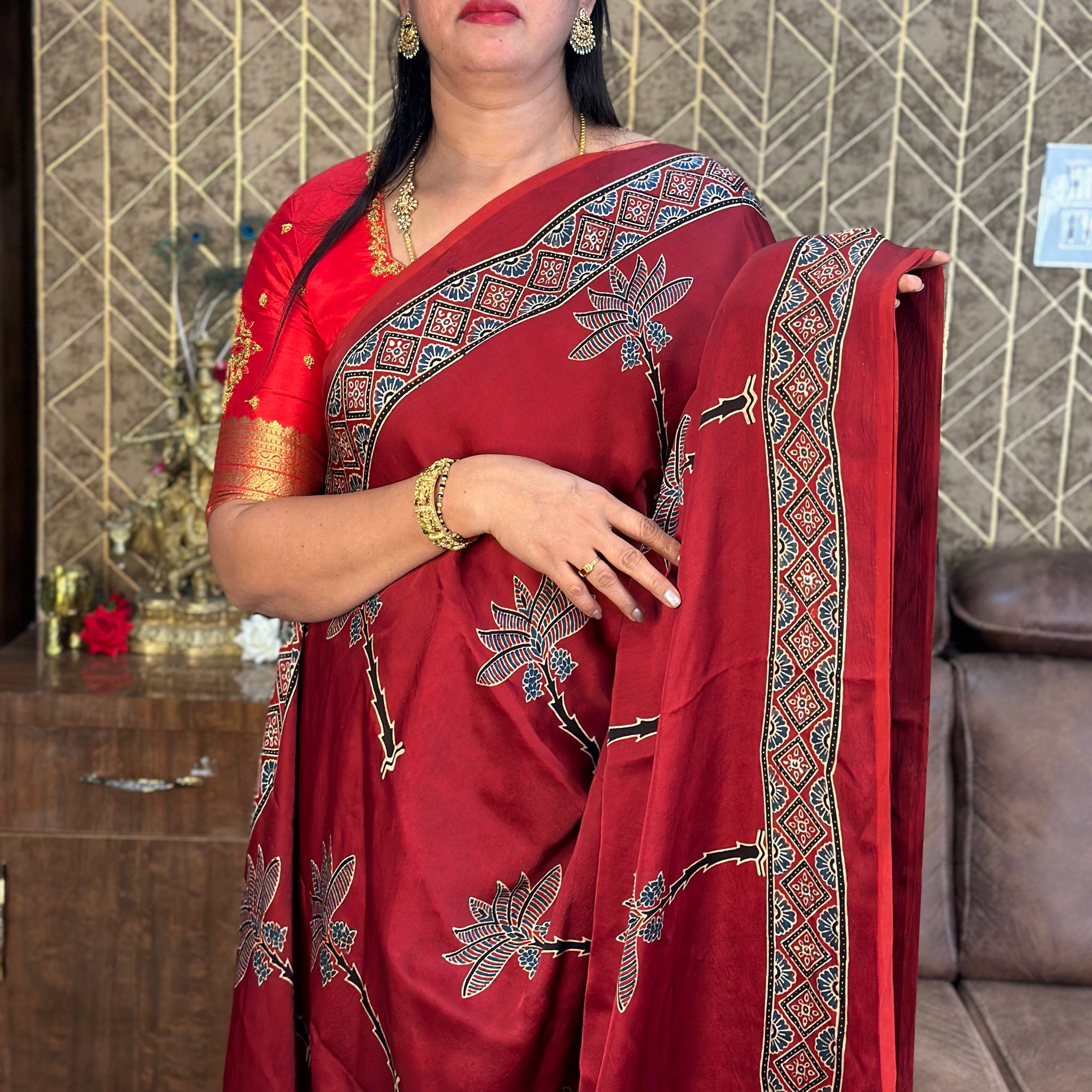 Brick red pure modal silk sarees.