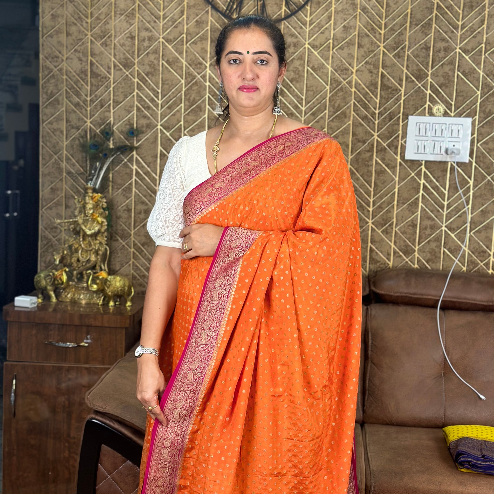 Orange and pink pure crepe Banaras silk sarees with Lehariya pattern blouse