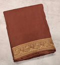 Light brown Kanchi border plain modal silk saree