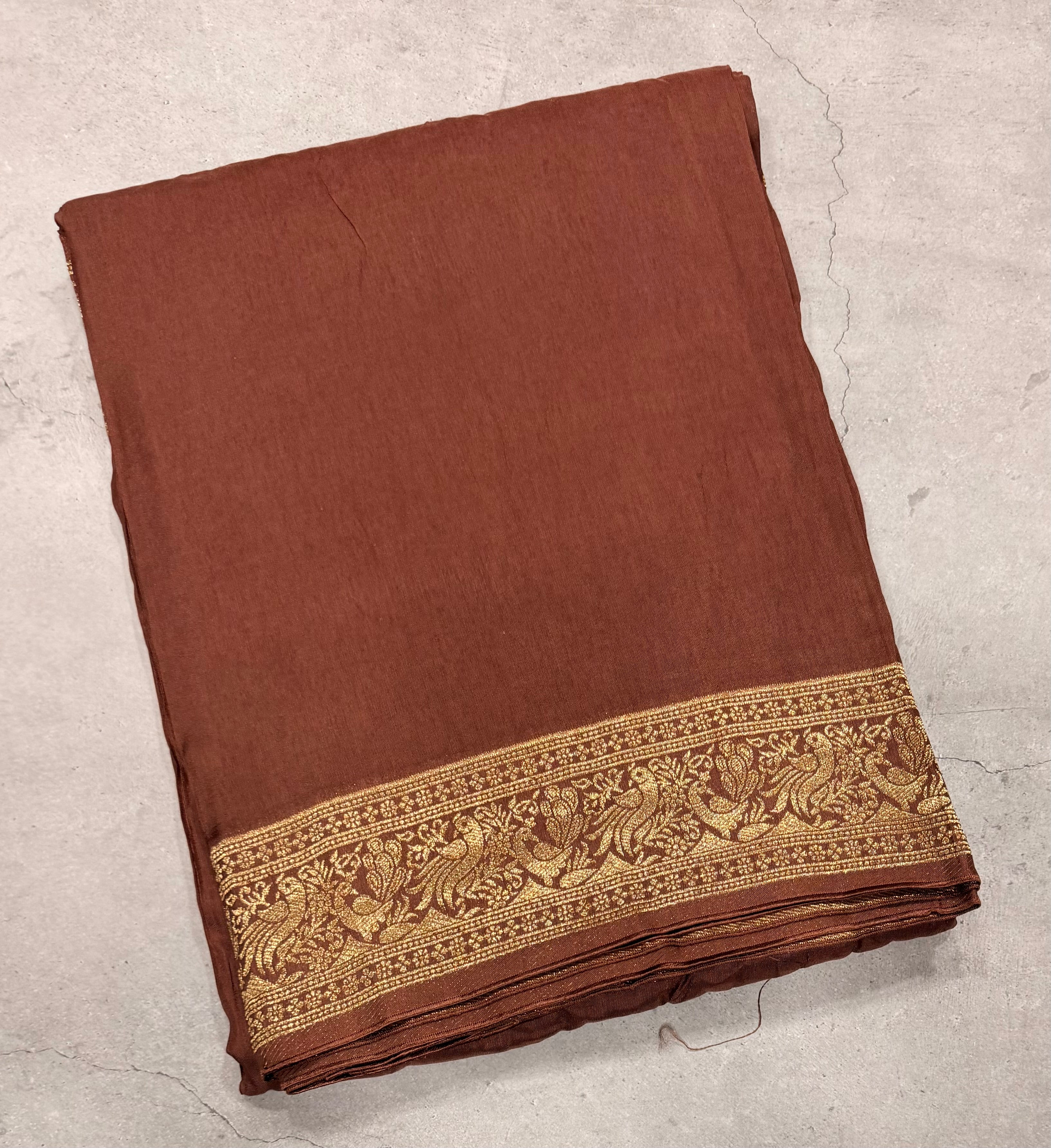 Light brown Kanchi border plain modal silk saree