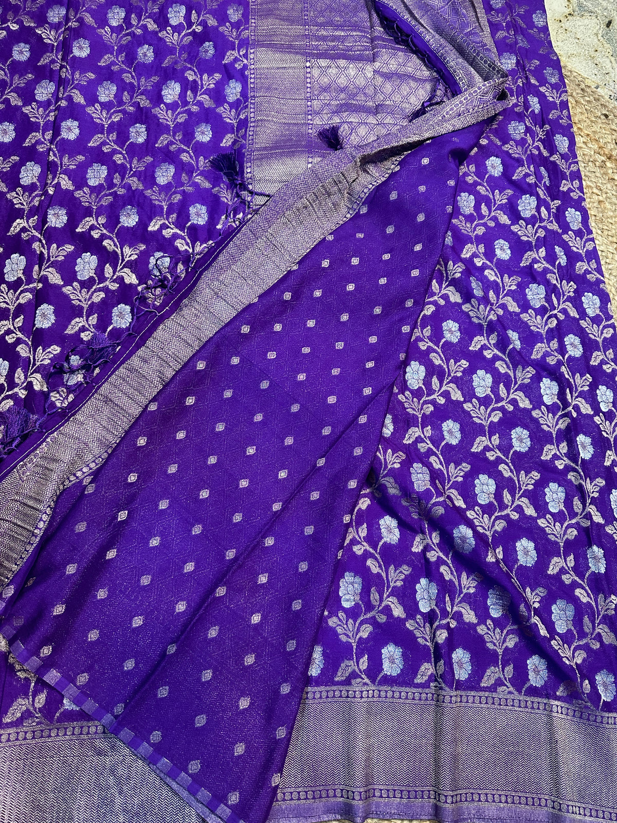 Purple designer georgette in jaal pattern saree.