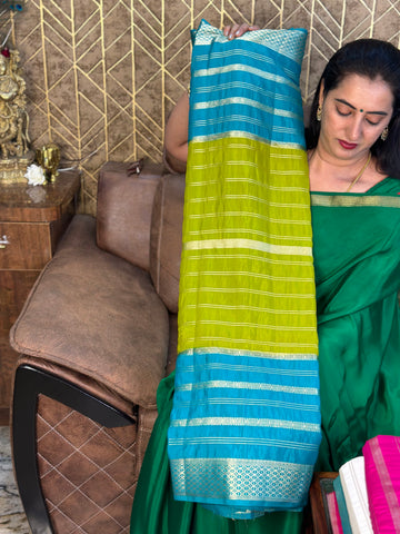 Rama green with mustard semi crepe sarees.