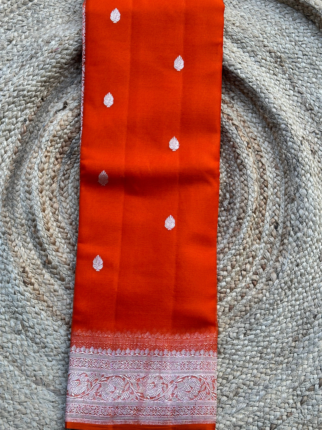 Rust orange pure khaddi chiffon silver zari hand woven sarees