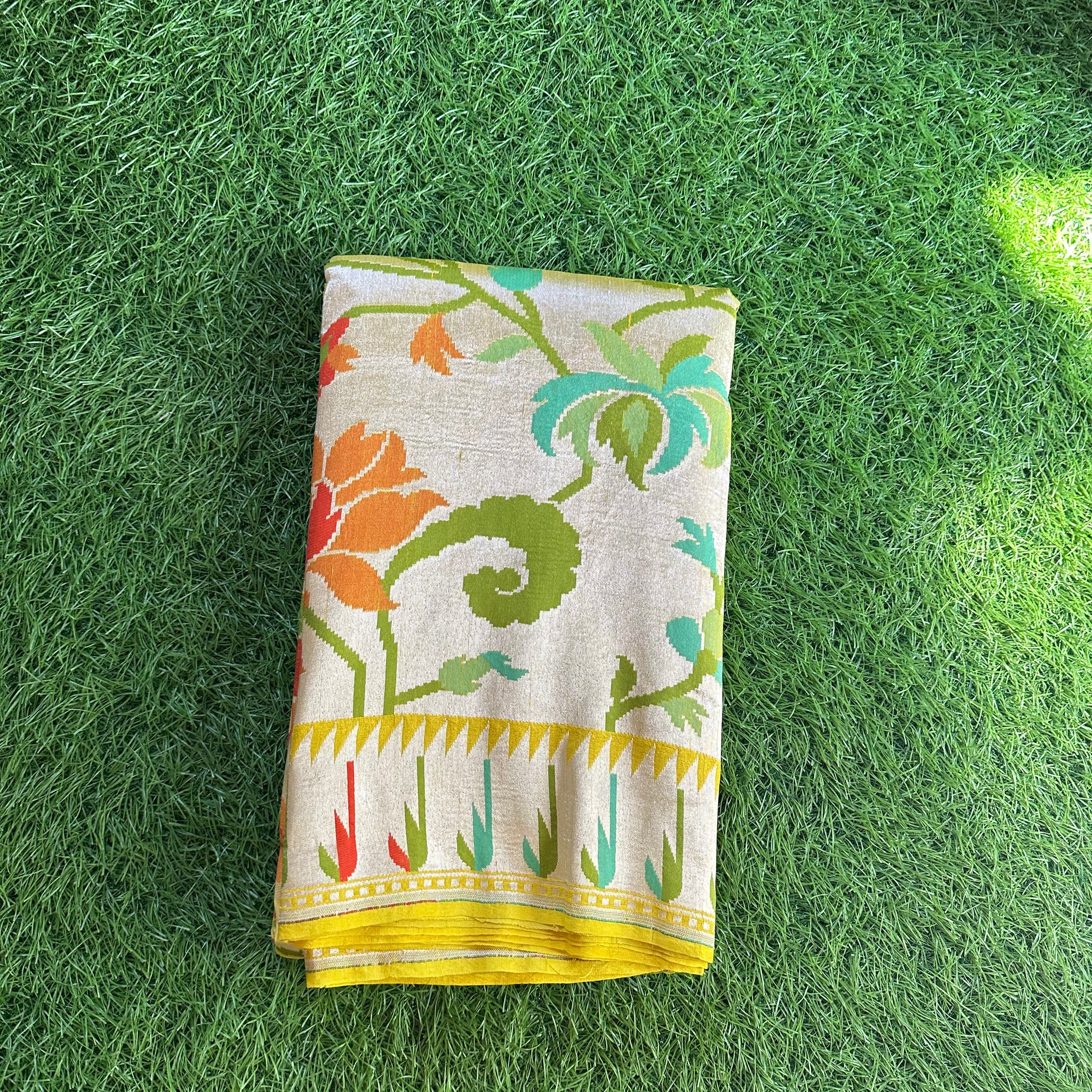 Lemon yellow pure tusser tissue georgette with Paithani weaving muniya border.