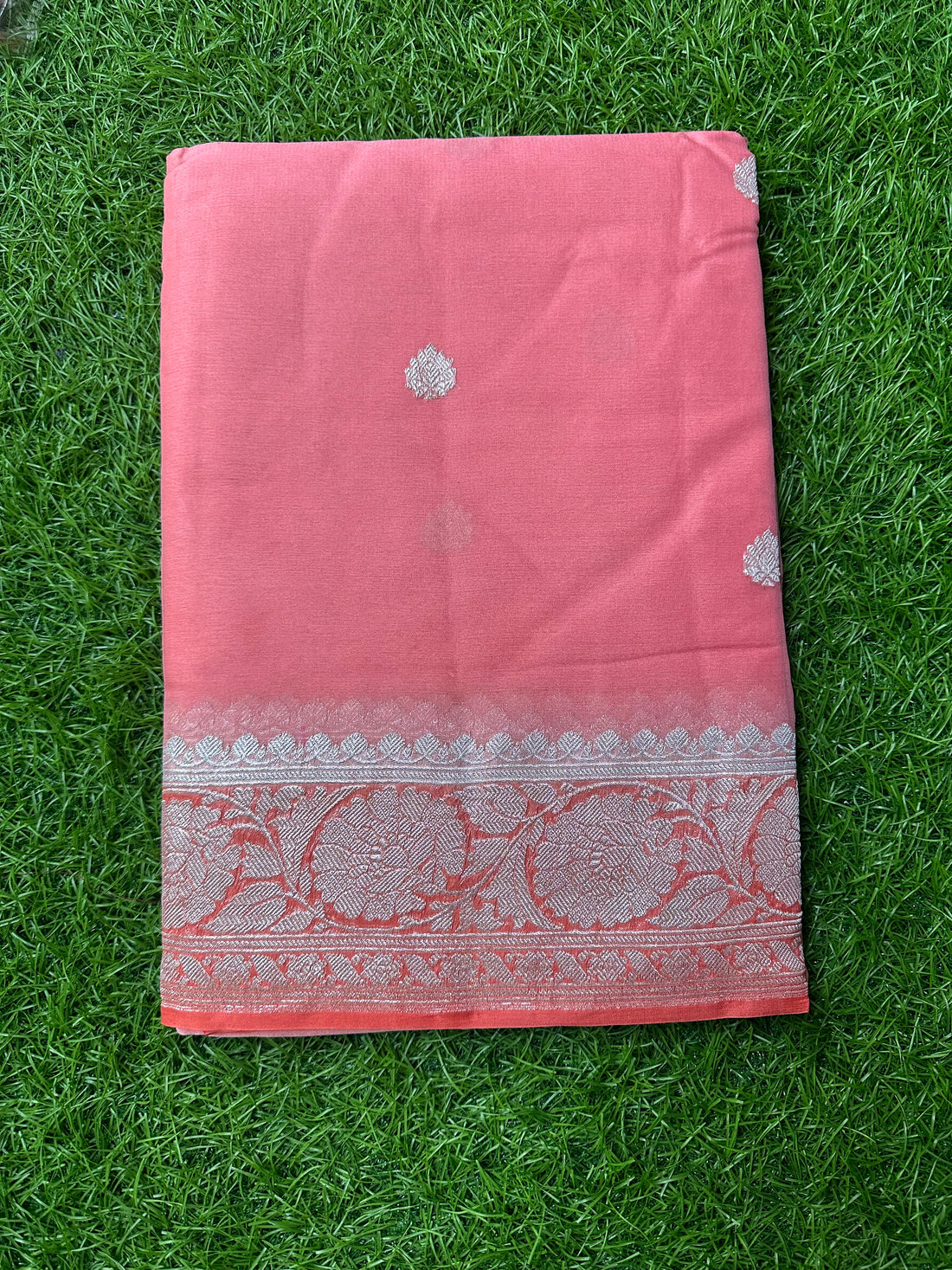 Peach with orange pure khaddi chiffon sarees.