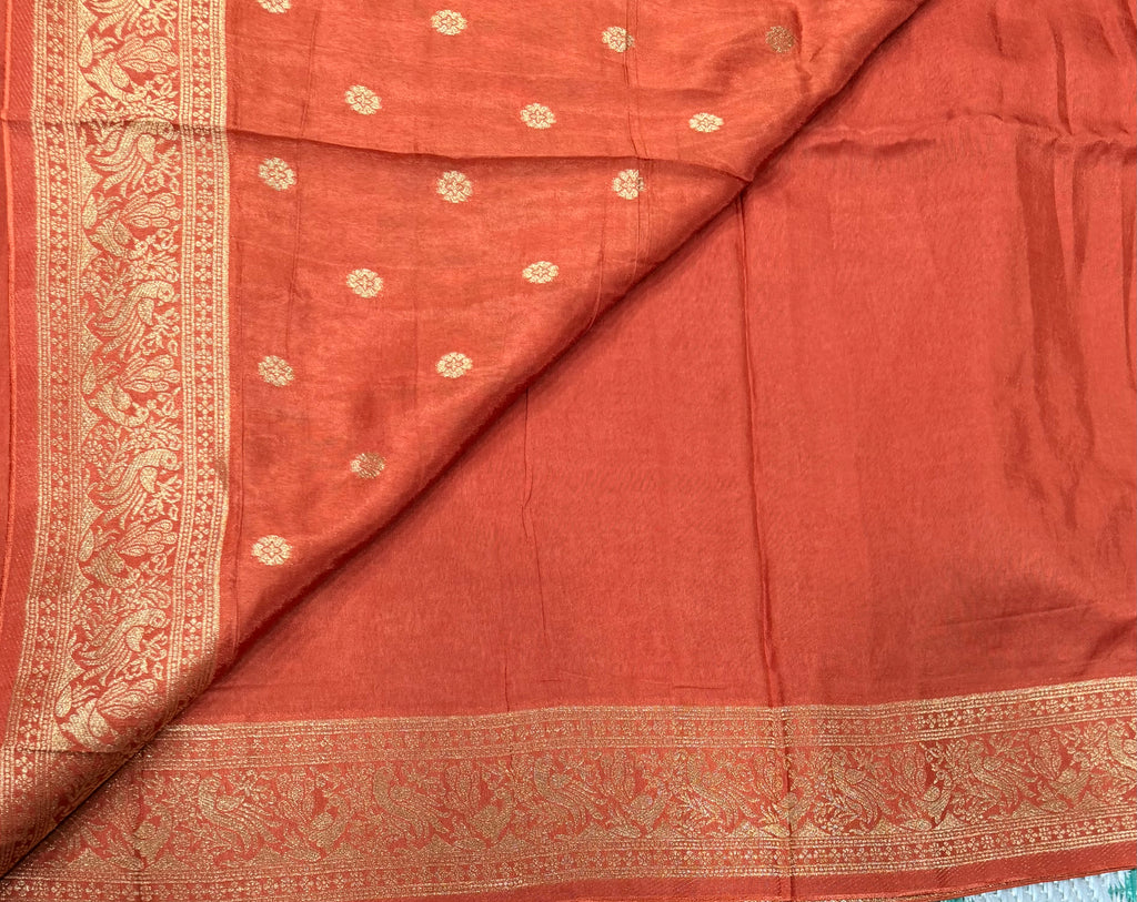 Rust orange Kanchi border plain modal silk saree