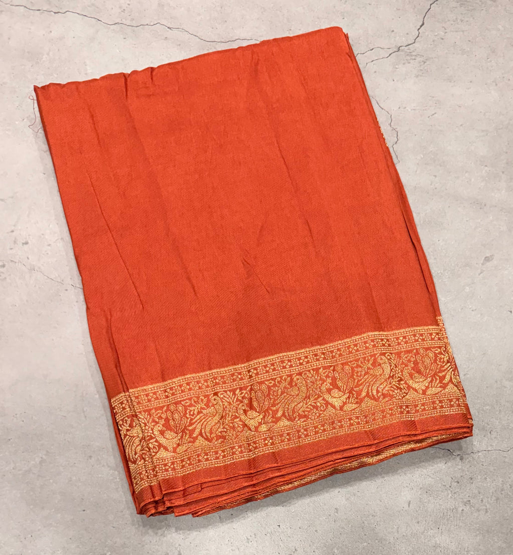 Rust orange Kanchi border plain modal silk saree