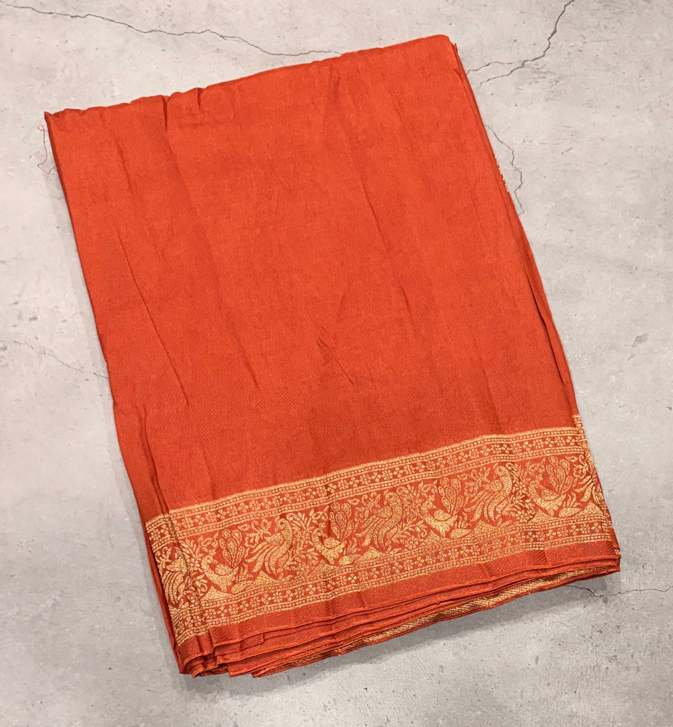 Rust orange Kanchi border plain modal silk saree