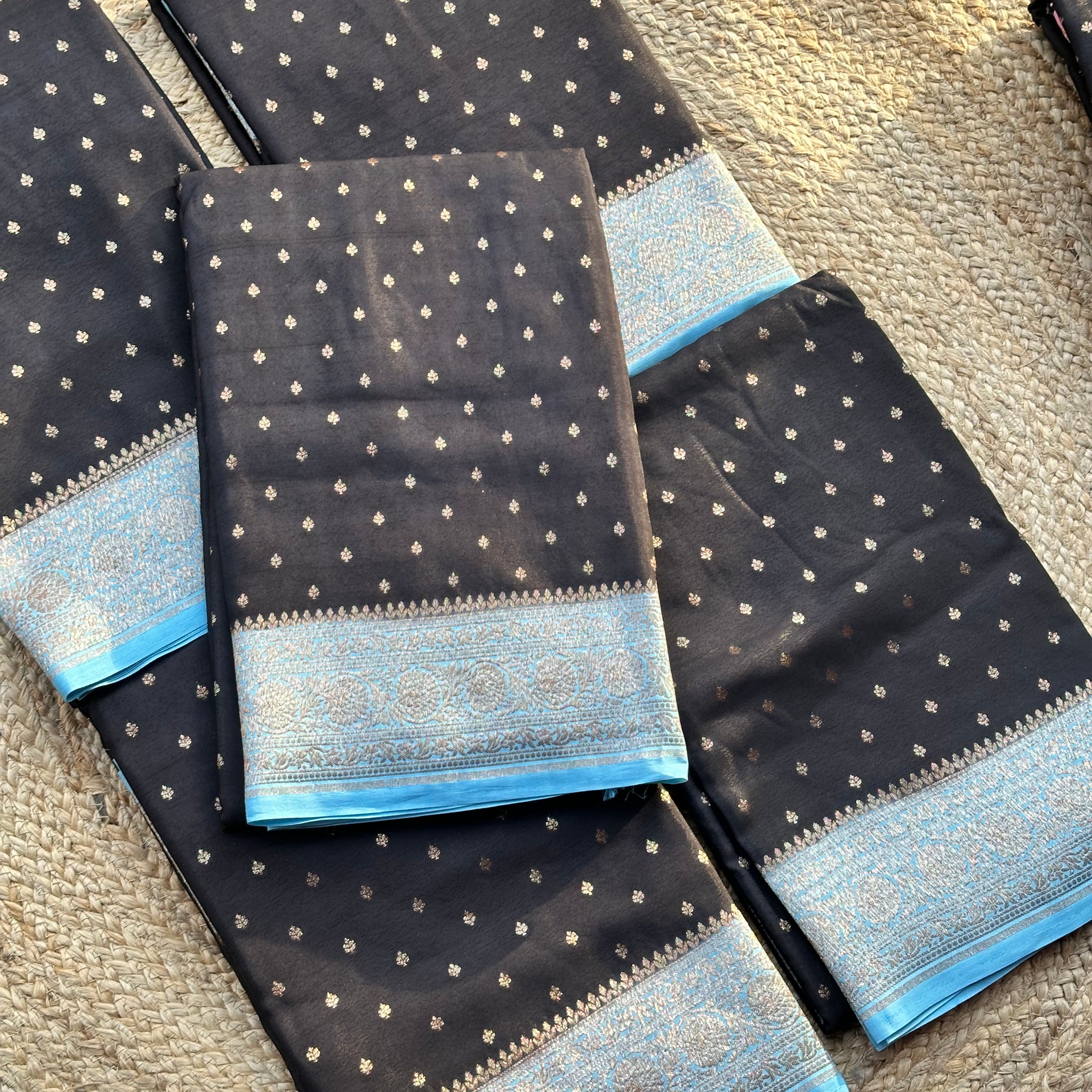 Black and sky blue Banarasi crepe chiffon sarees with brocade blouse