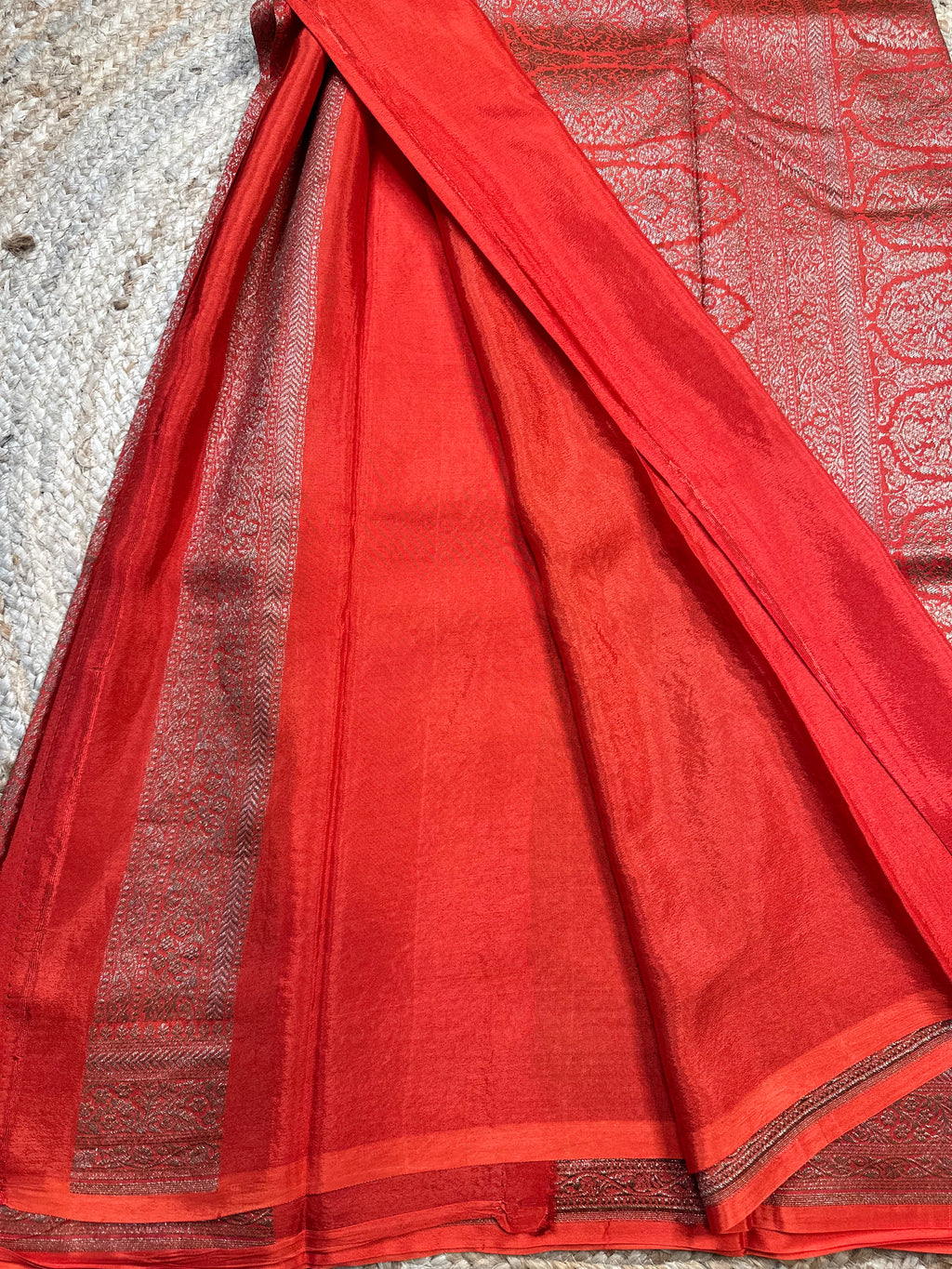Orange brocade crepe chiffon sarees.