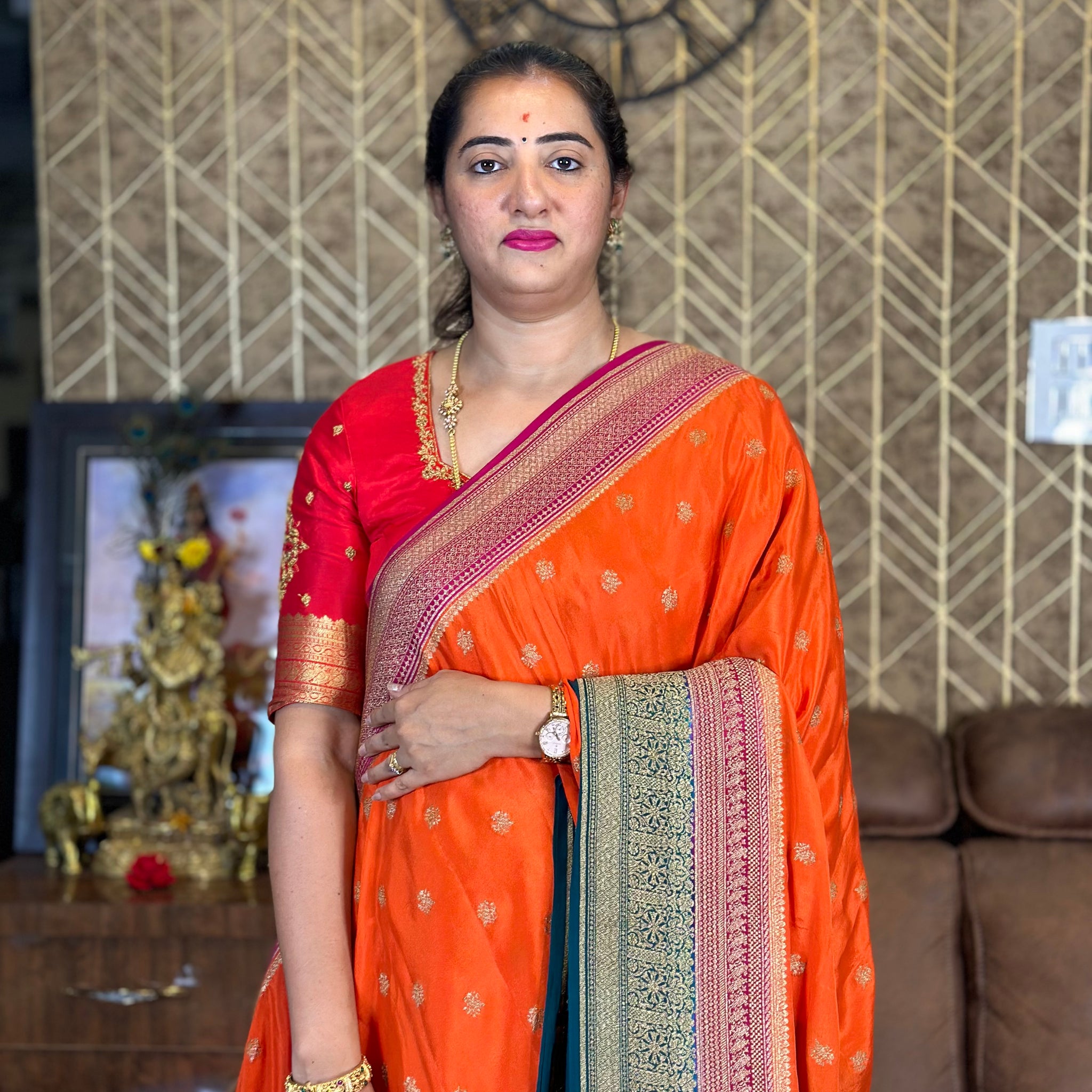 Orange and peacock green pure crepe Banaras.