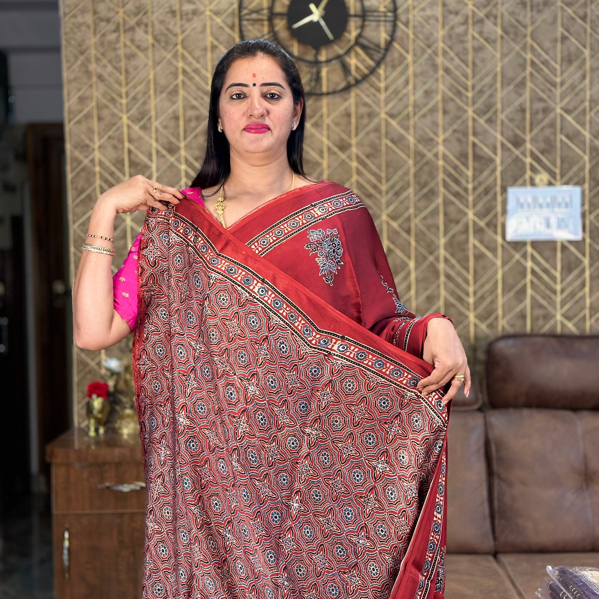 Brick red pure modal silk saree.