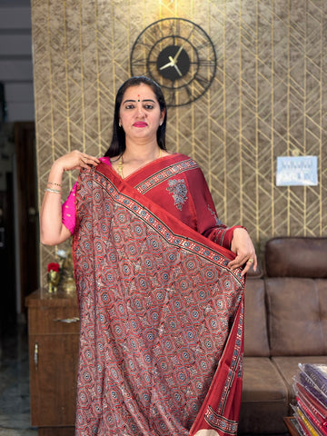 Brick red pure modal silk saree.