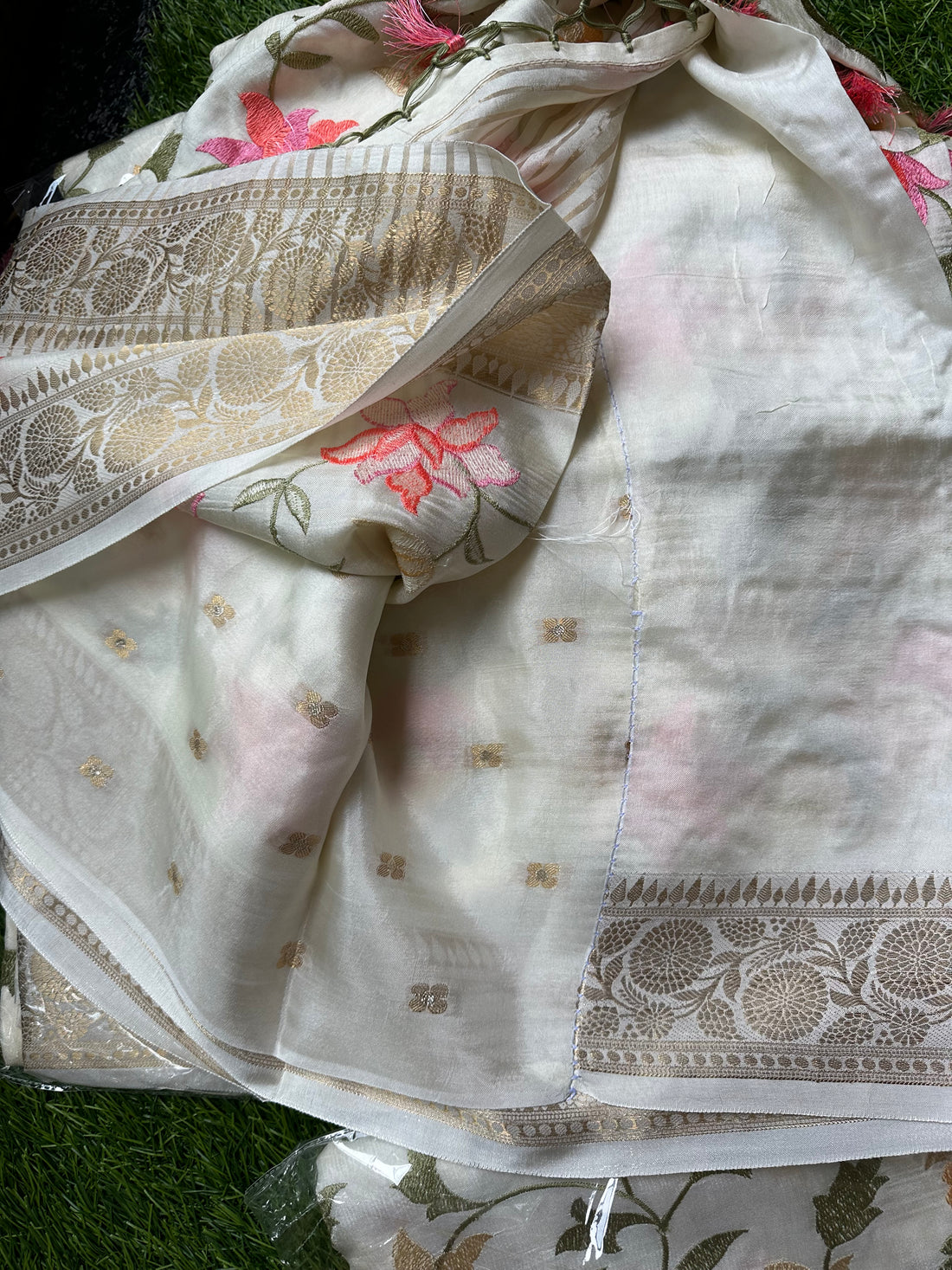 Dola silk embroidery all over the body half white.