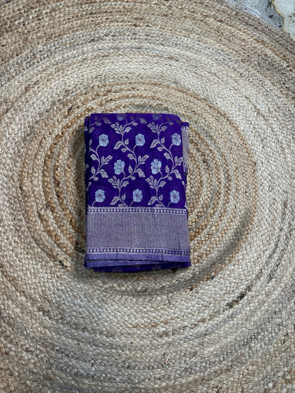 Purple designer georgette in jaal pattern saree.