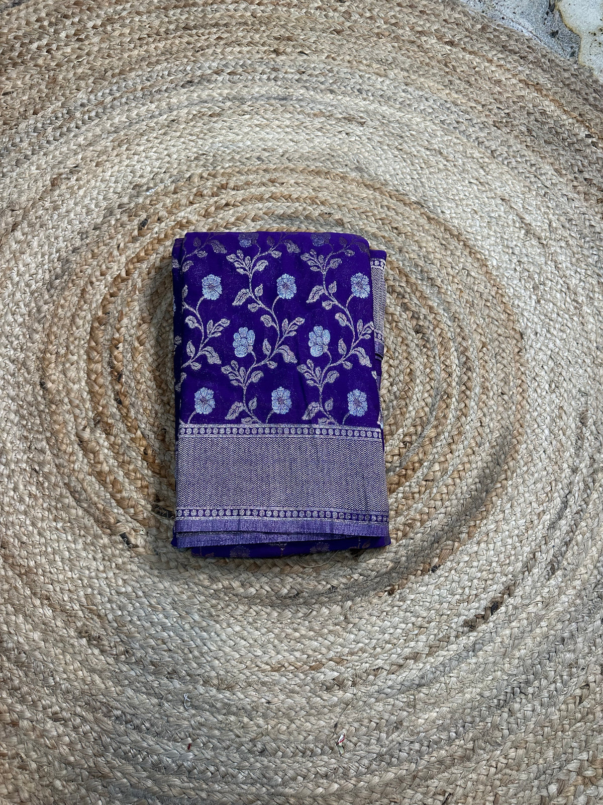 Purple designer georgette in jaal pattern saree.