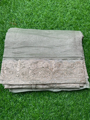 Pistha green pure tissue Banarasi with embroidery borders.