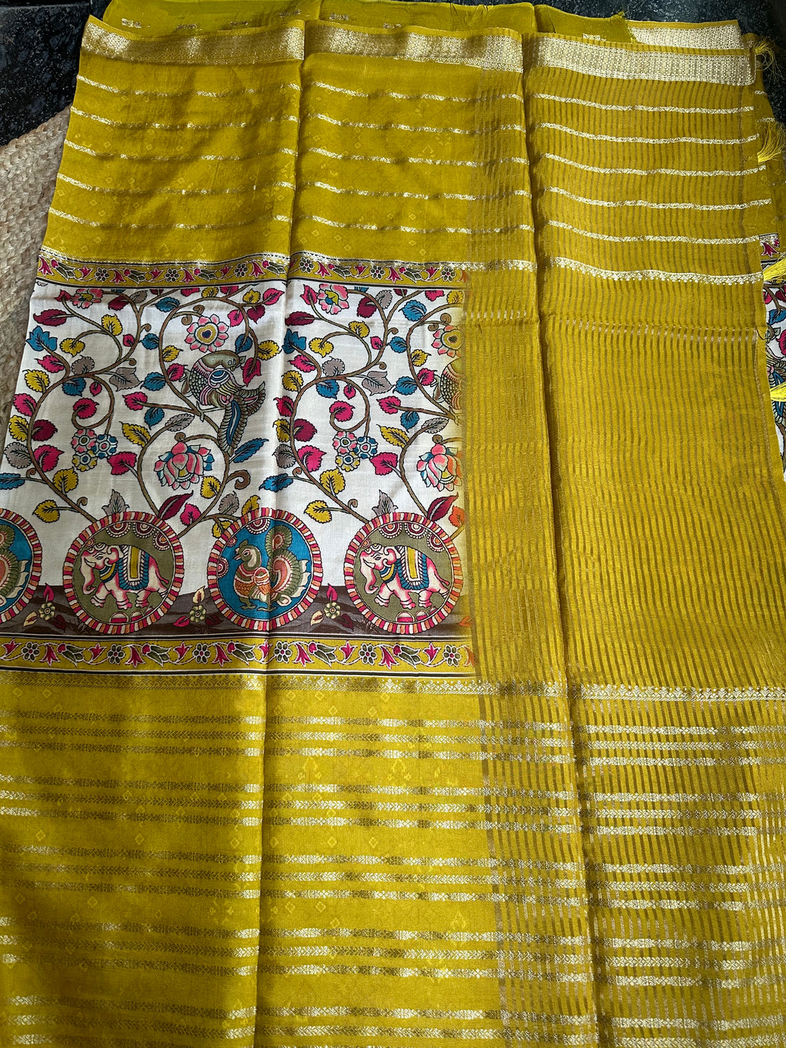 Mustard crepe central kalamkari sarees.