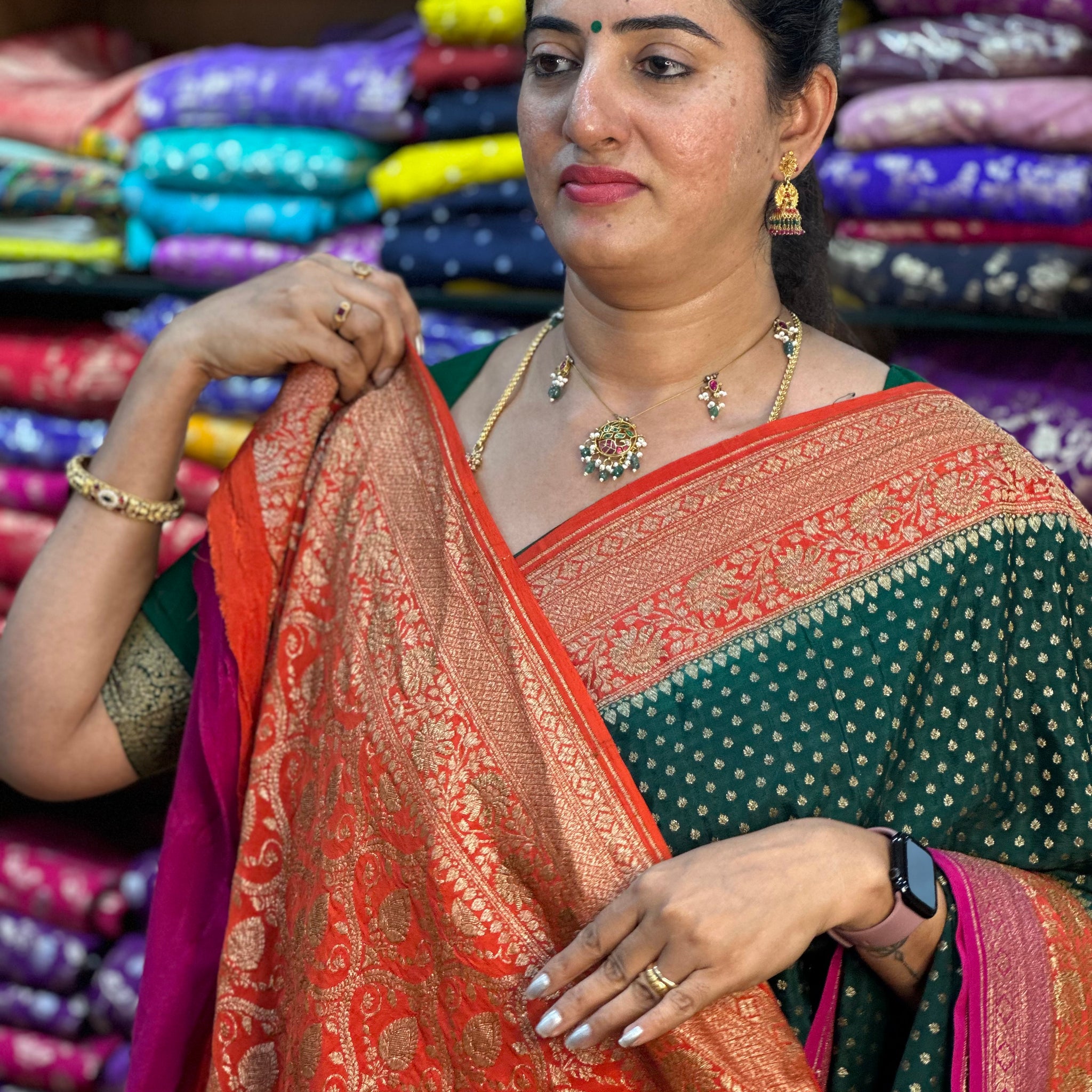 Green and orange pure crepe Banaras silk sarees.