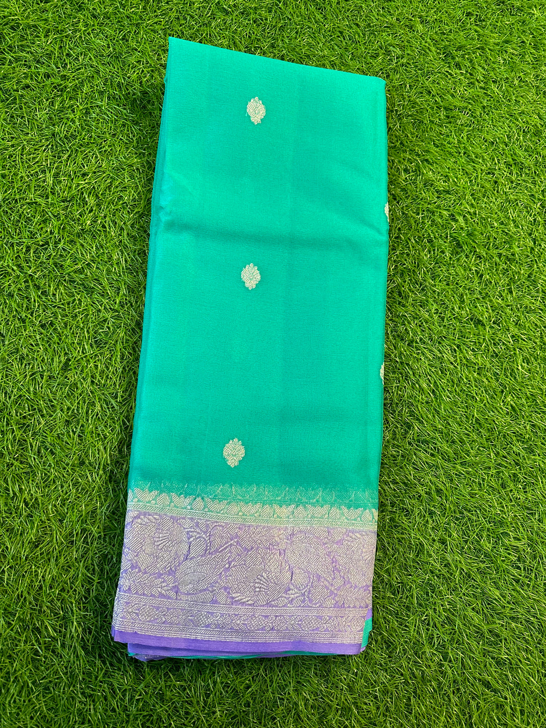 Teal green with lavender pure khaddi chiffon Banarasi sarees.