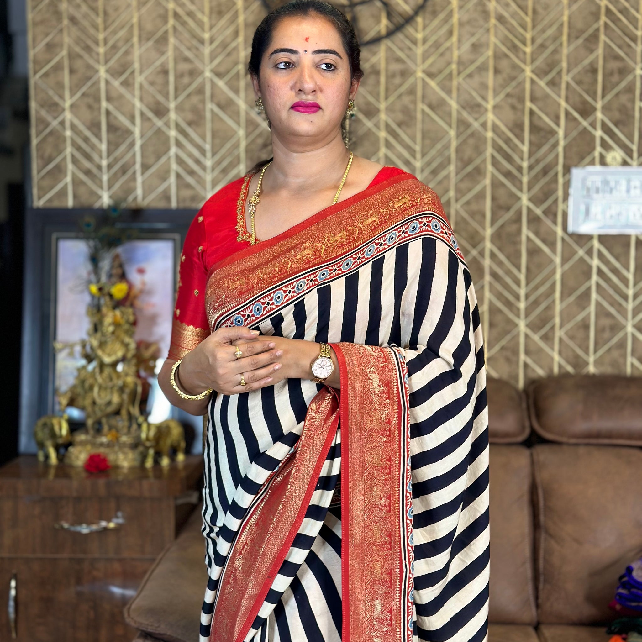 Modal dola silk with black stripes zari border pallu.