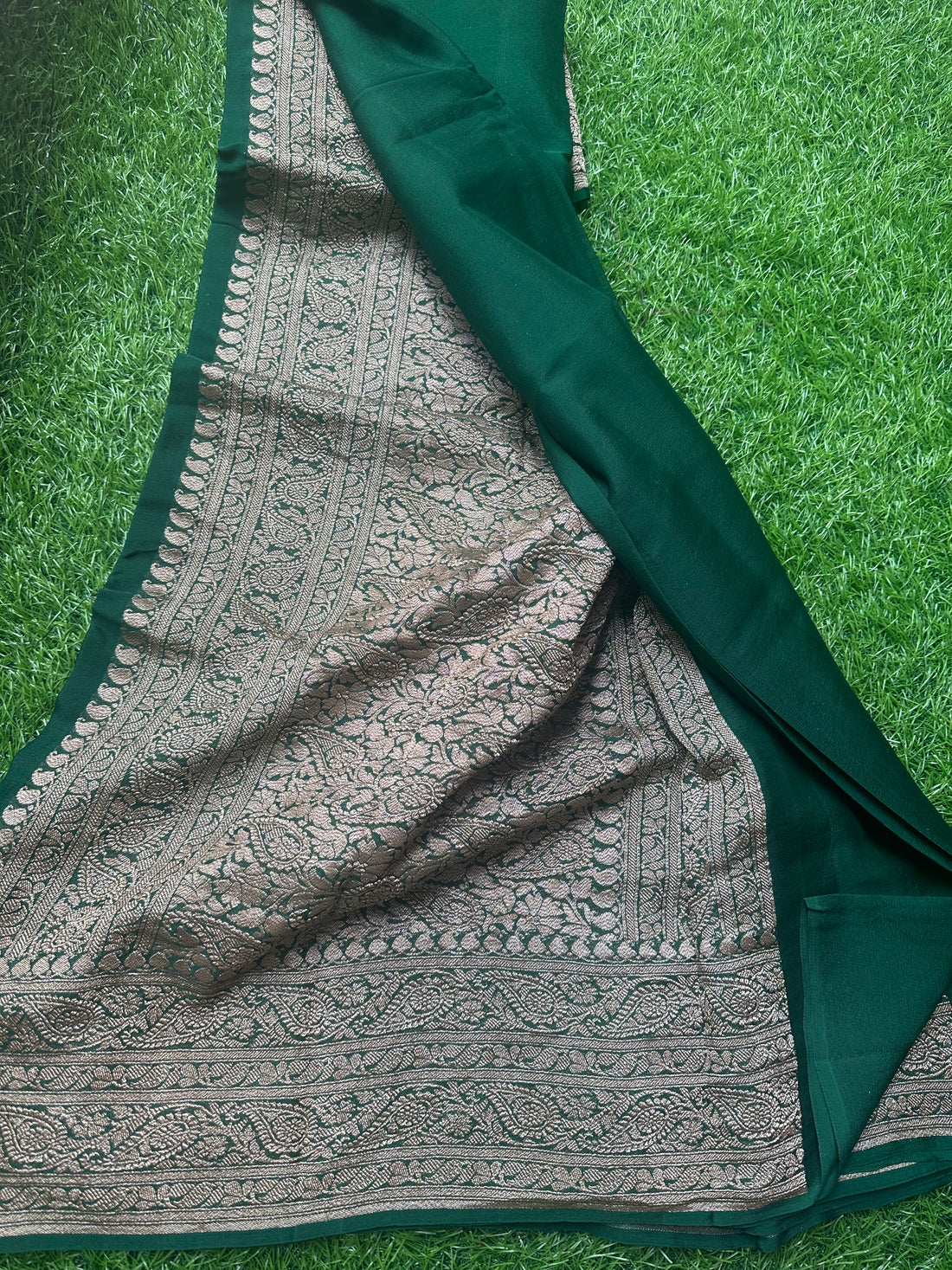 Pure Georgette Banaras. Bottle green shade, rich pallu and blouse.