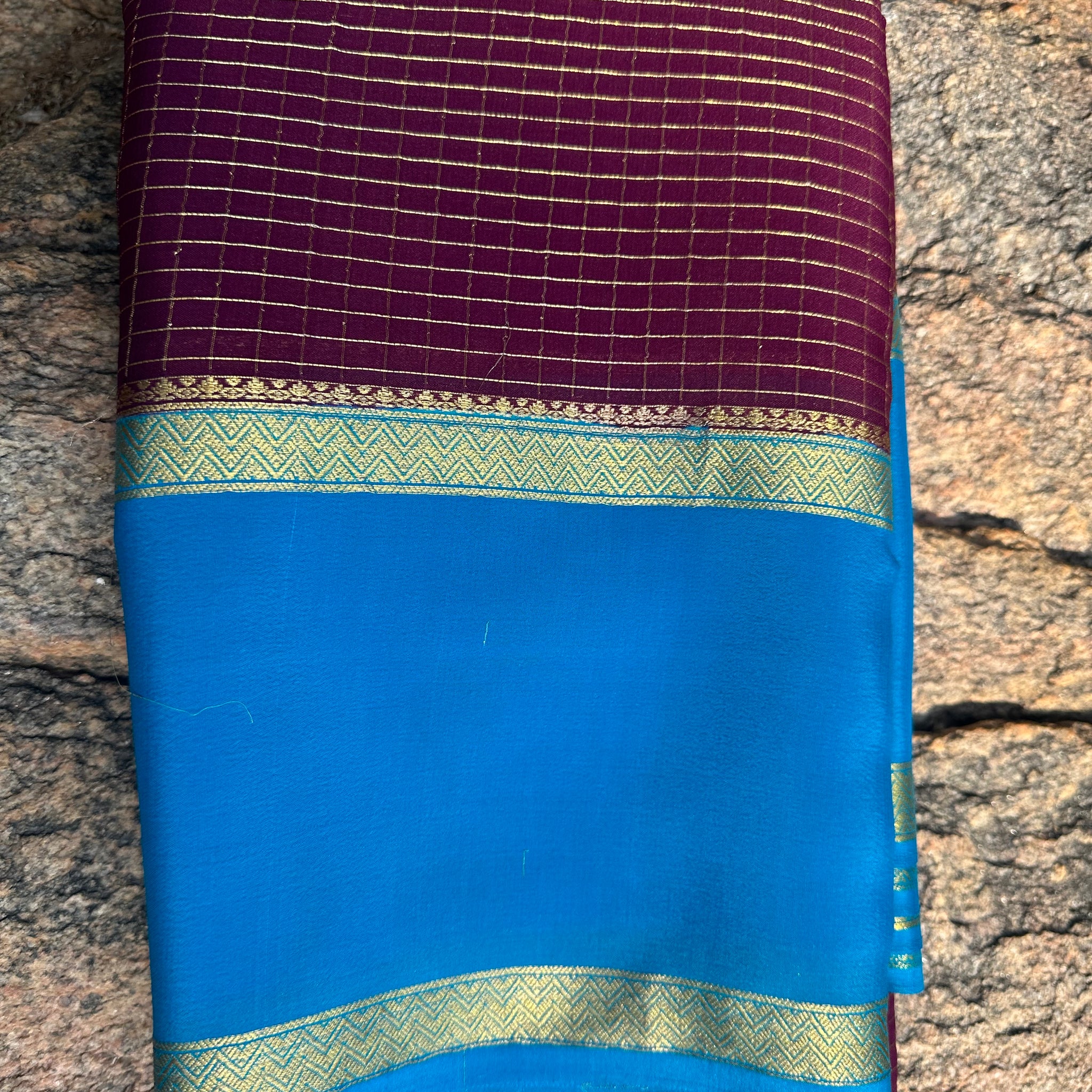 Mejentha with sky blue, Mysore Silk crepe checks with bentex border. 70 grams thickness.