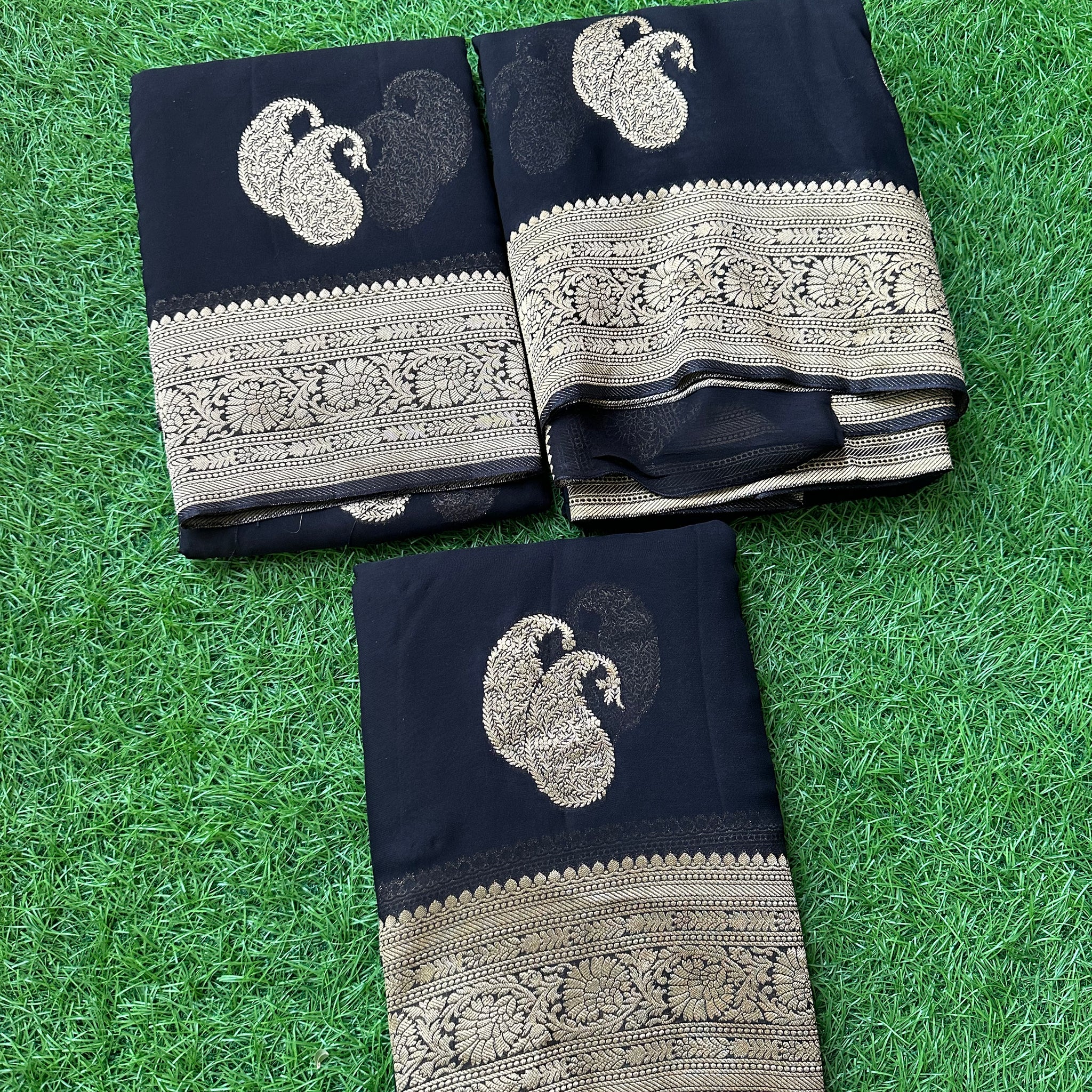Black pure viscose georgette with mango motives.