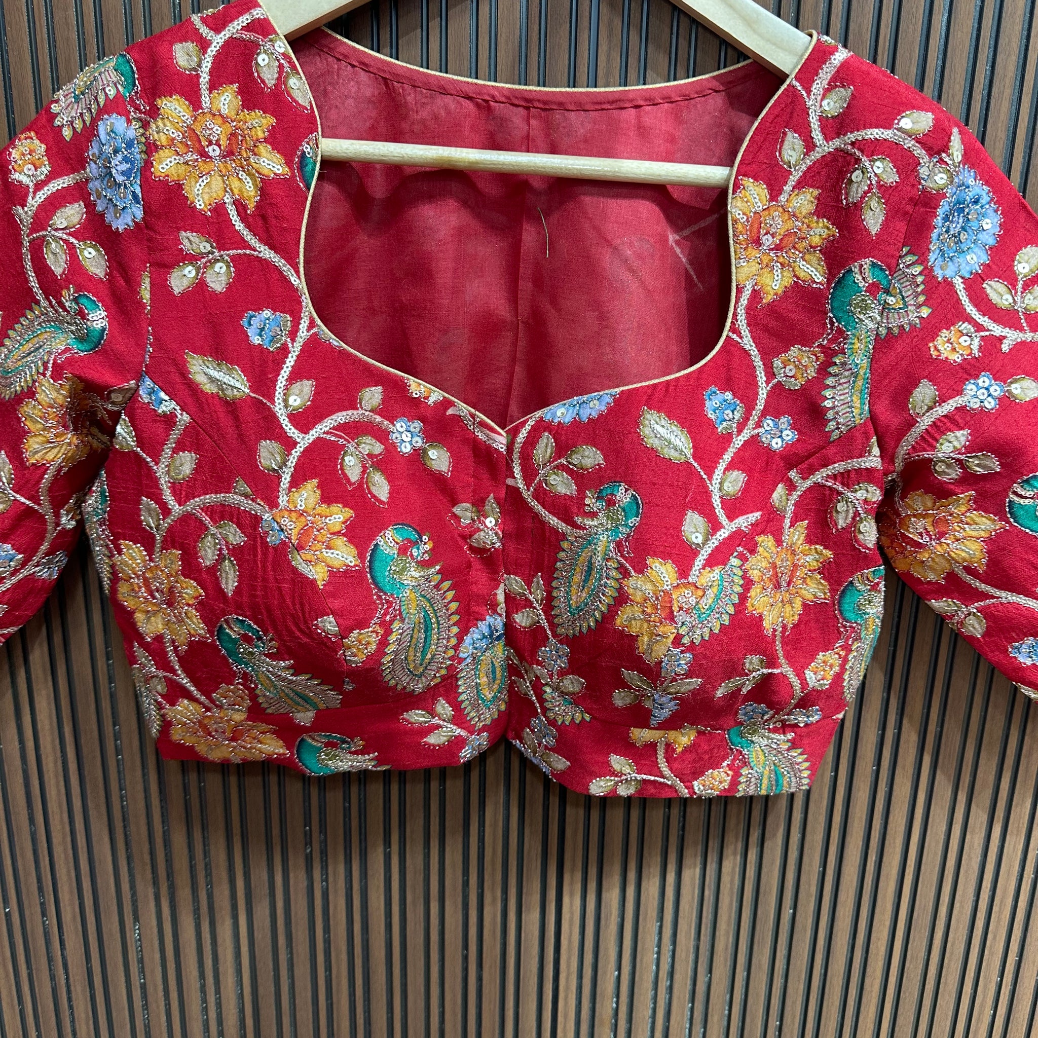 Red kalamkari stitched blouse L to XXL size margin high neck pattern.