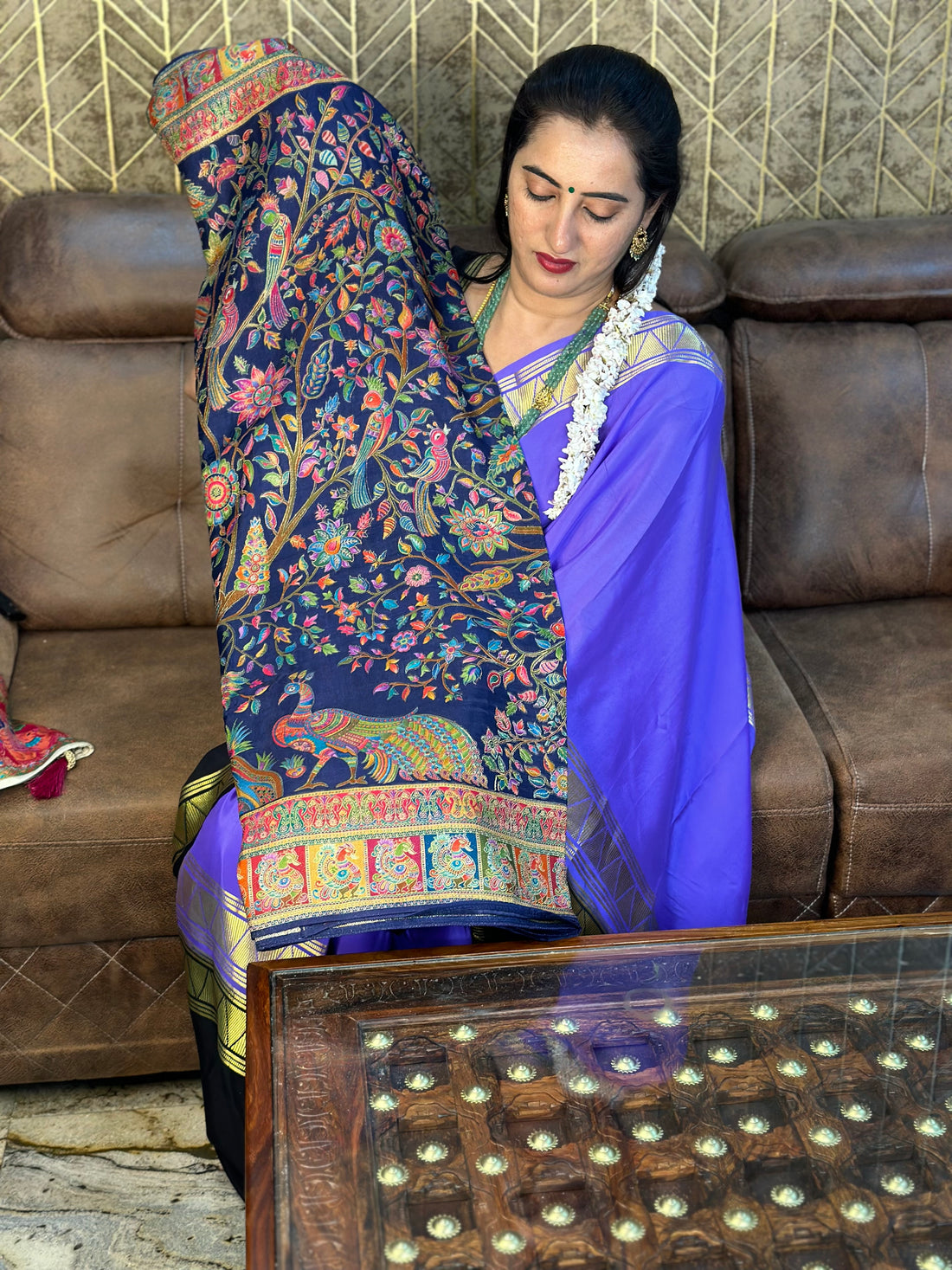 Navy blue pure moonga crepe saree with Kashmiri work all over the body.