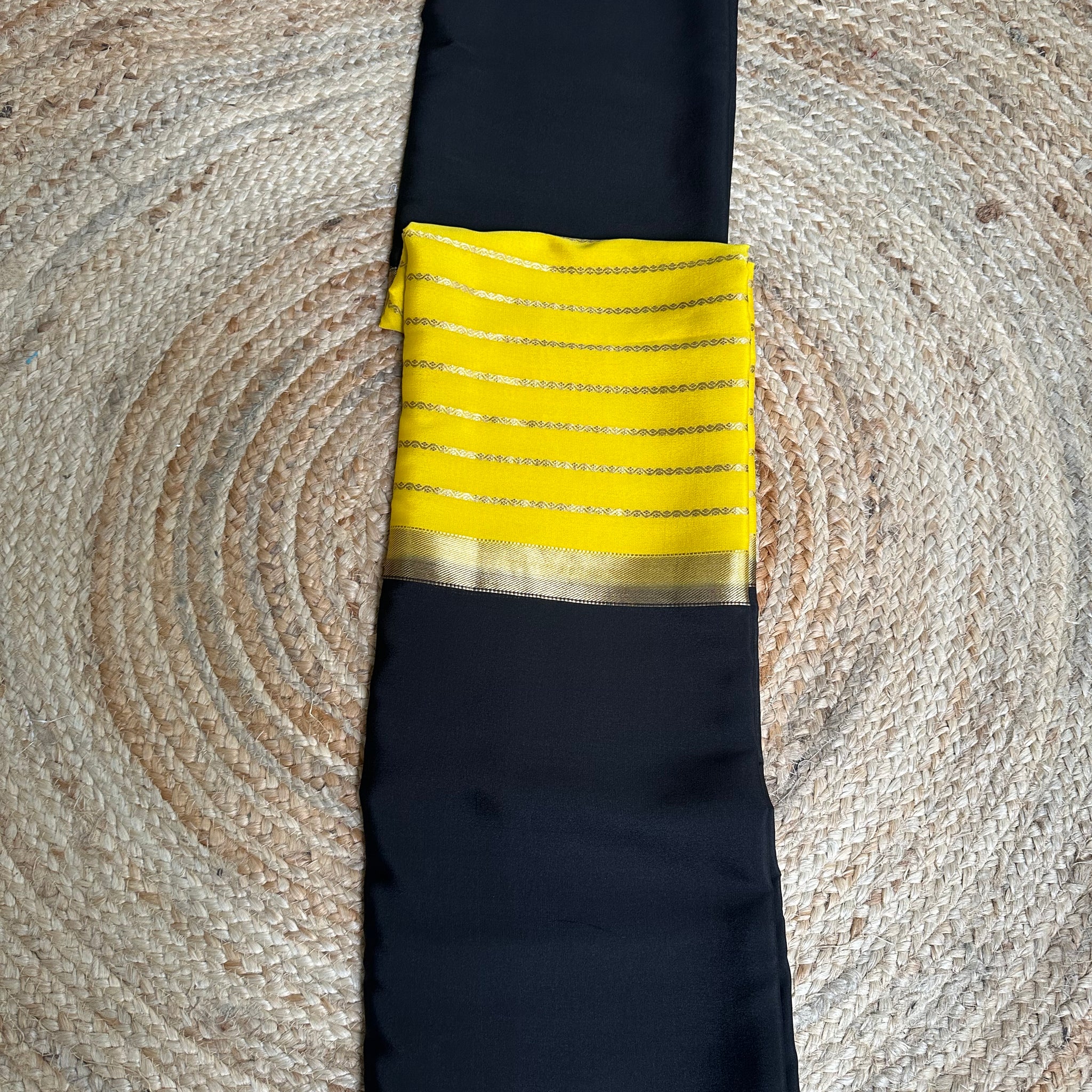 Yellow and black pure Mysore Silk crepe 100 gsm centre line pattern.
