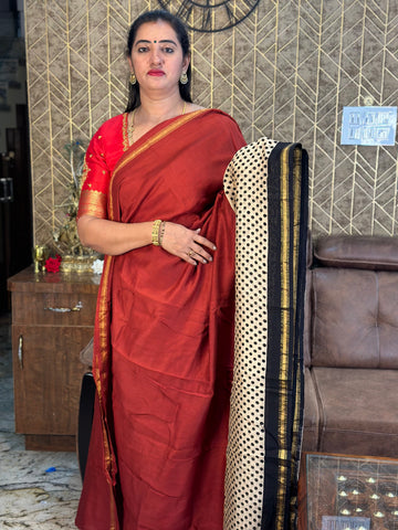 Red with white dots black border.