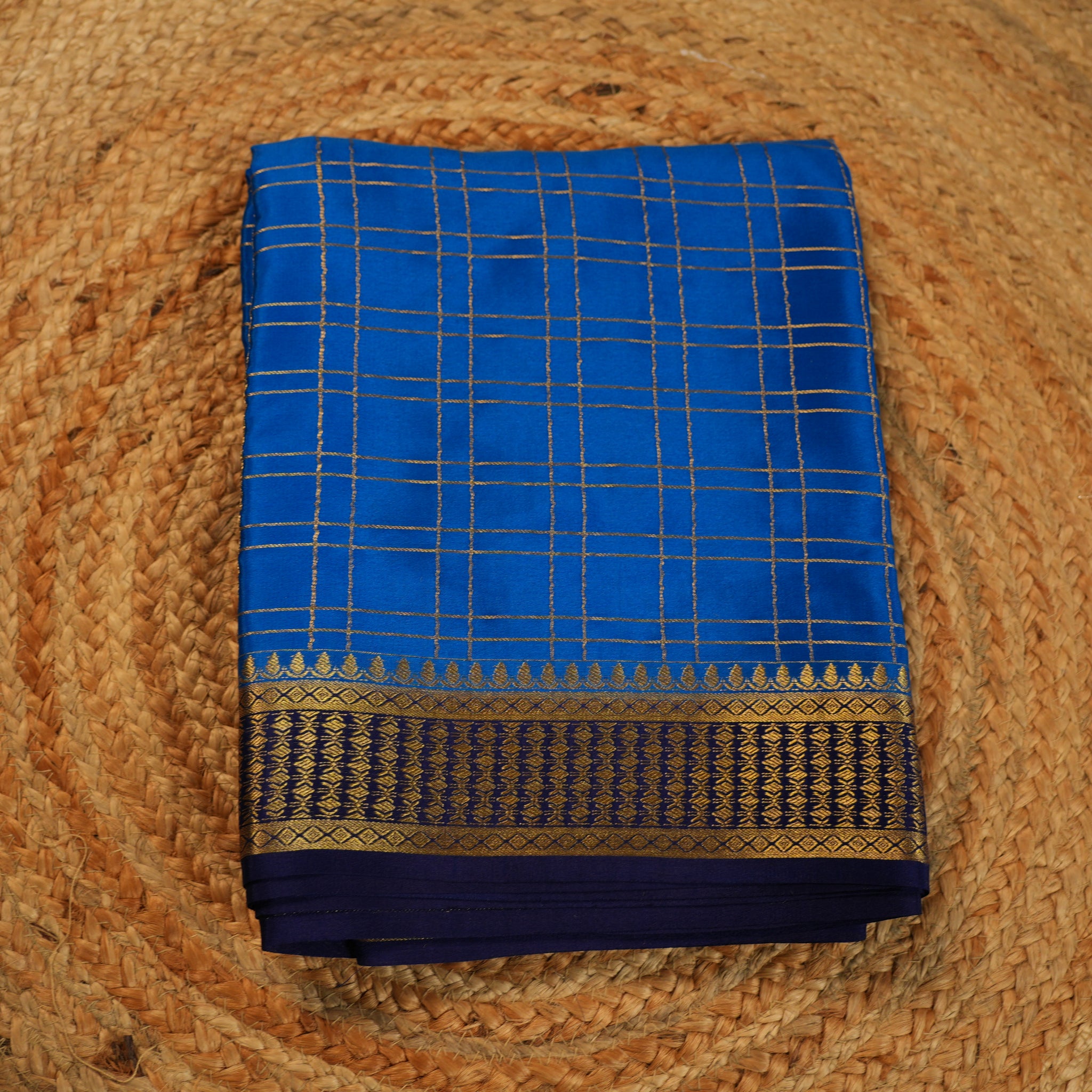 Sky blue with navy blue Pure Mysore silk 120 gsm checks pattern.