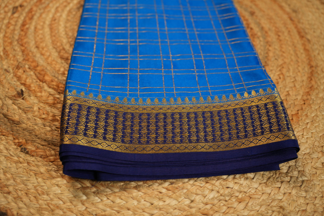 Sky blue with navy blue Pure Mysore silk 120 gsm checks pattern.