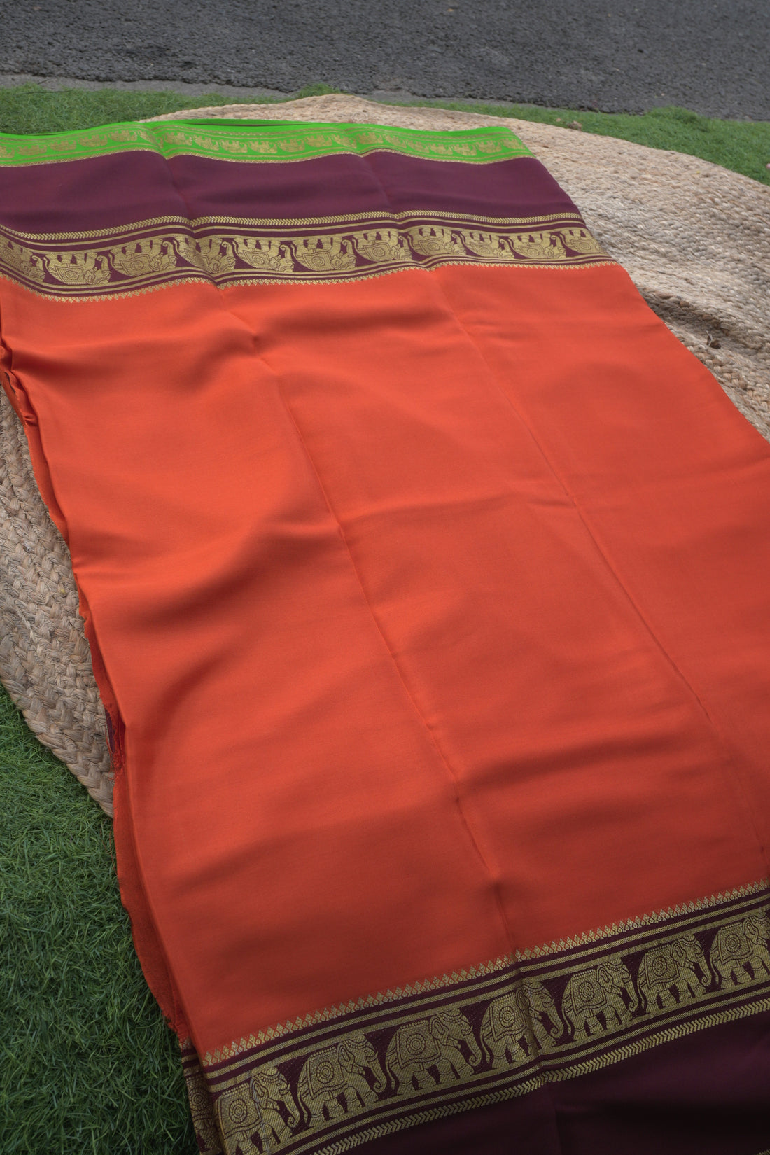 Mysuru Silk Crepe -Elephant 3D Border (120gsm) orange and coffee brown with green border
