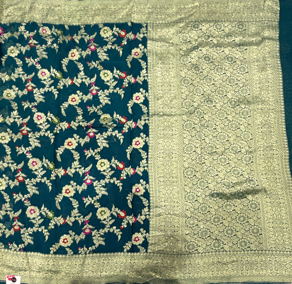 Peacock blue 2 jaal pattern pure georgette with water zari saree
