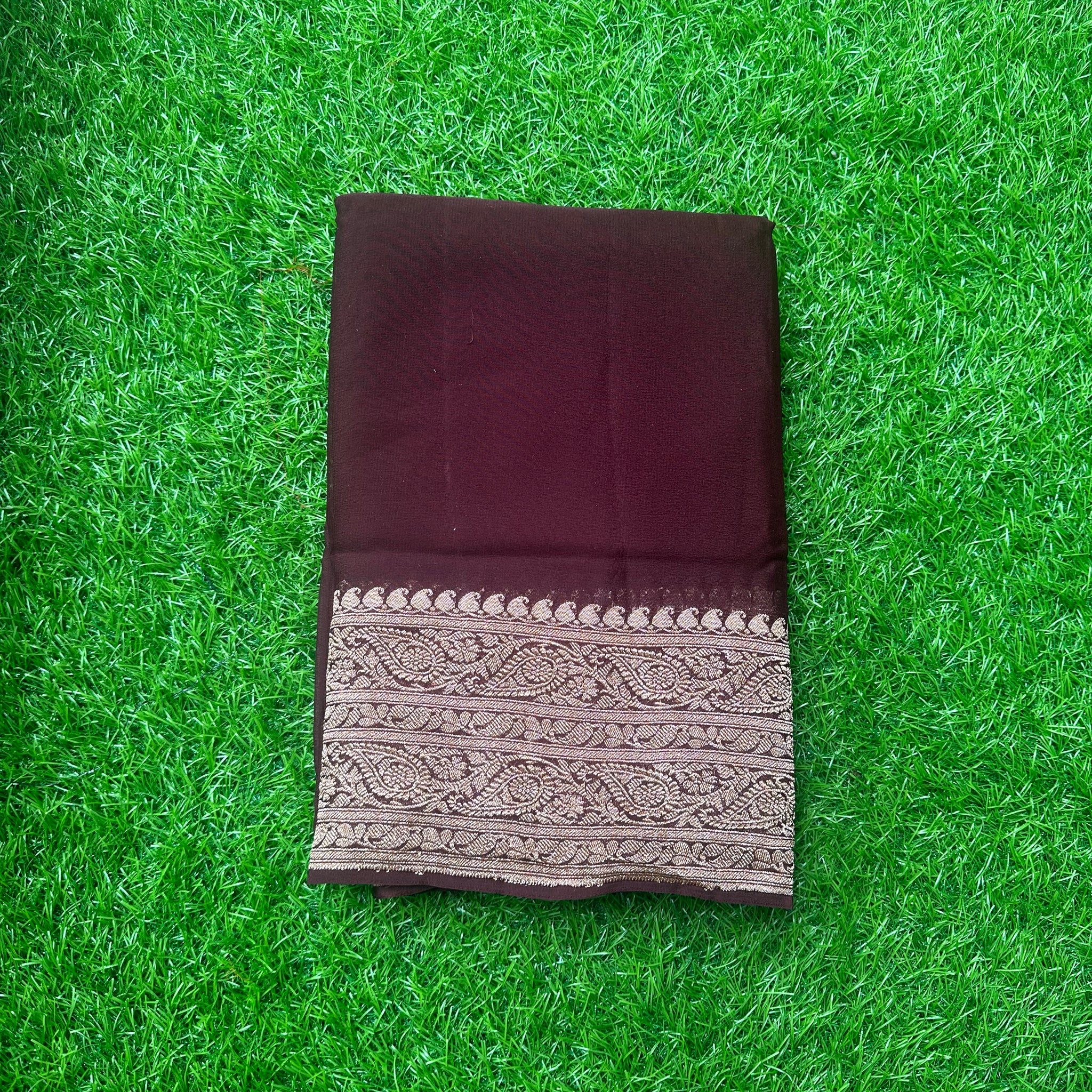 Dark chocolate brown pure georgette Banaras. Rich pallu and blouse.