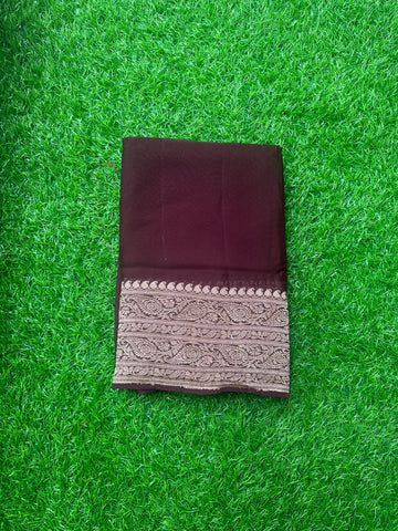 Dark chocolate brown pure georgette Banaras. Rich pallu and blouse.