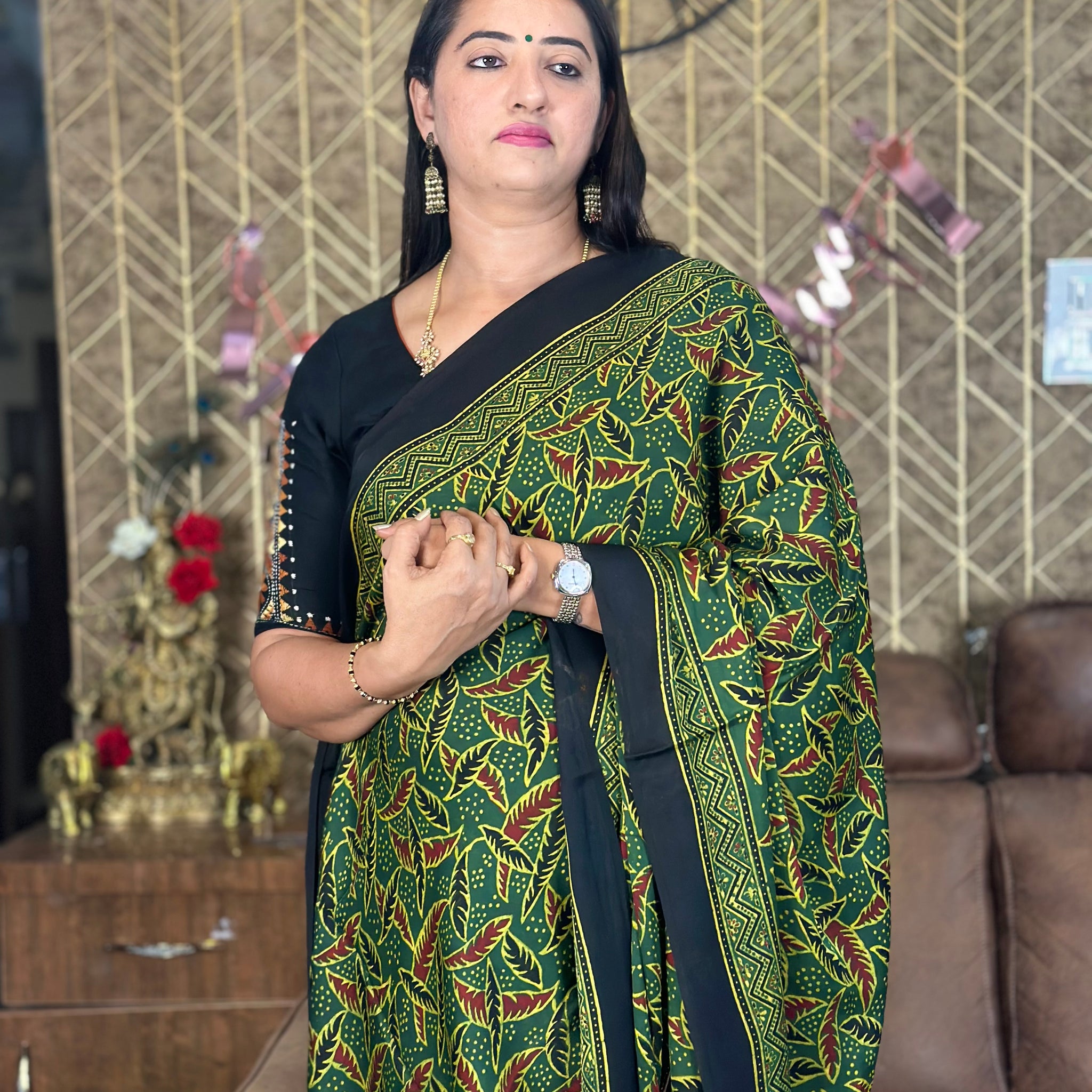 Green pure modal silk saree. Ajrak prints.