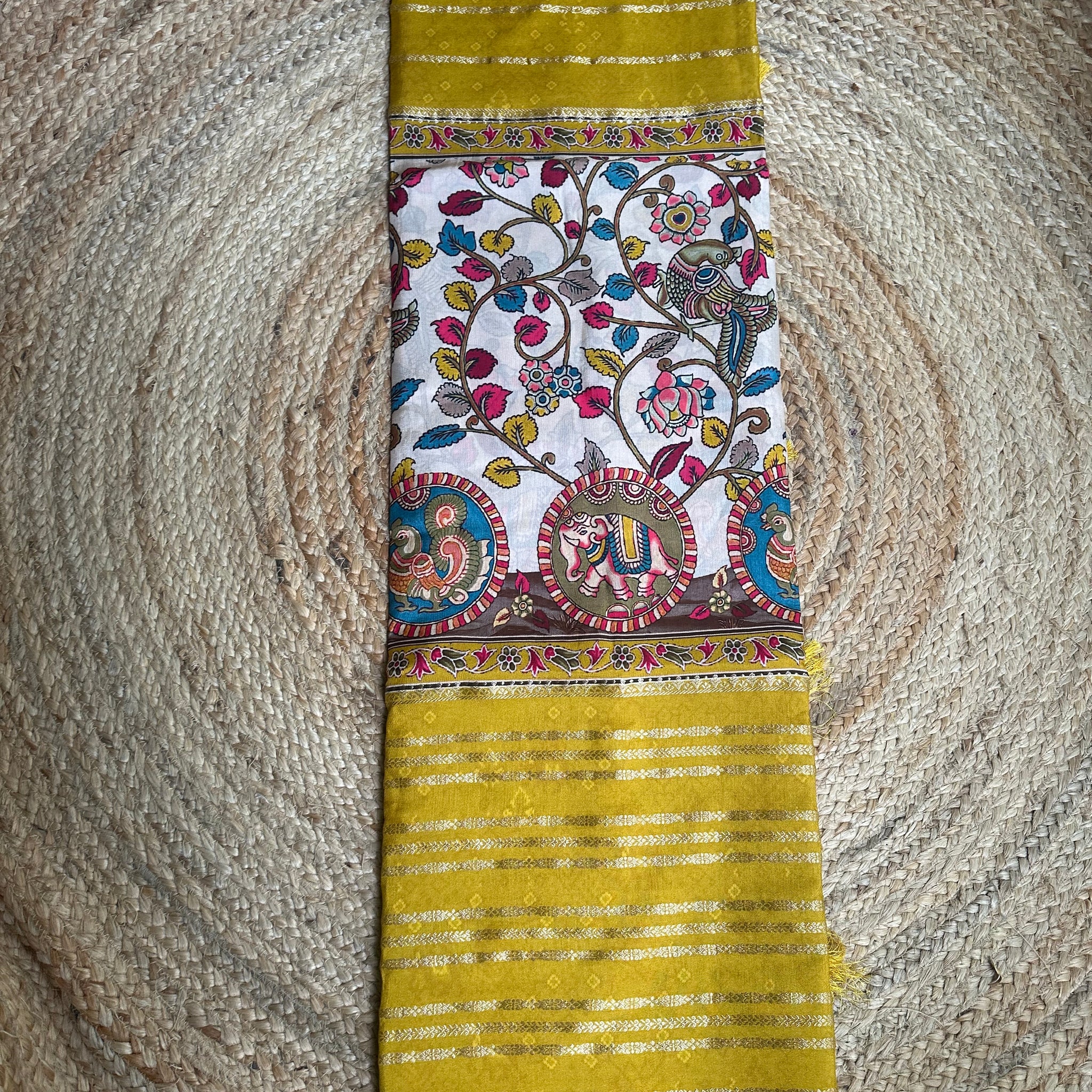 Mustard crepe central kalamkari sarees.