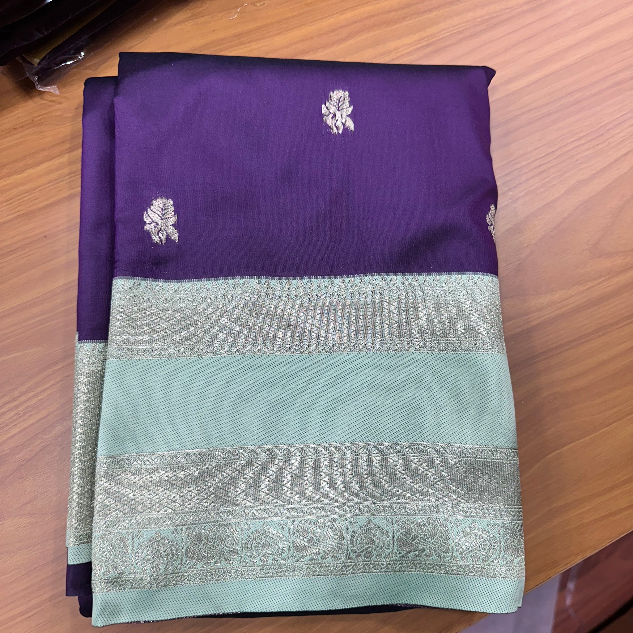 Brown and sea blue semi Kanchi sarees.
