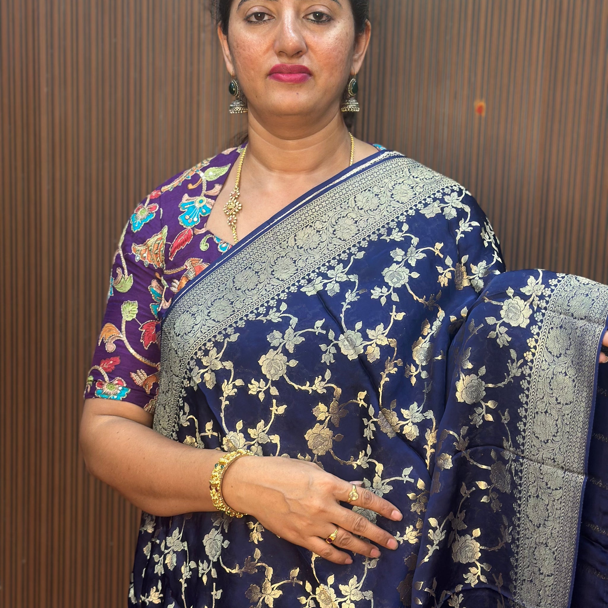 Deep blue satin organza saree.