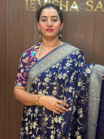 Deep blue satin organza saree.