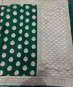 Bottle green pure georgette with water zari saree